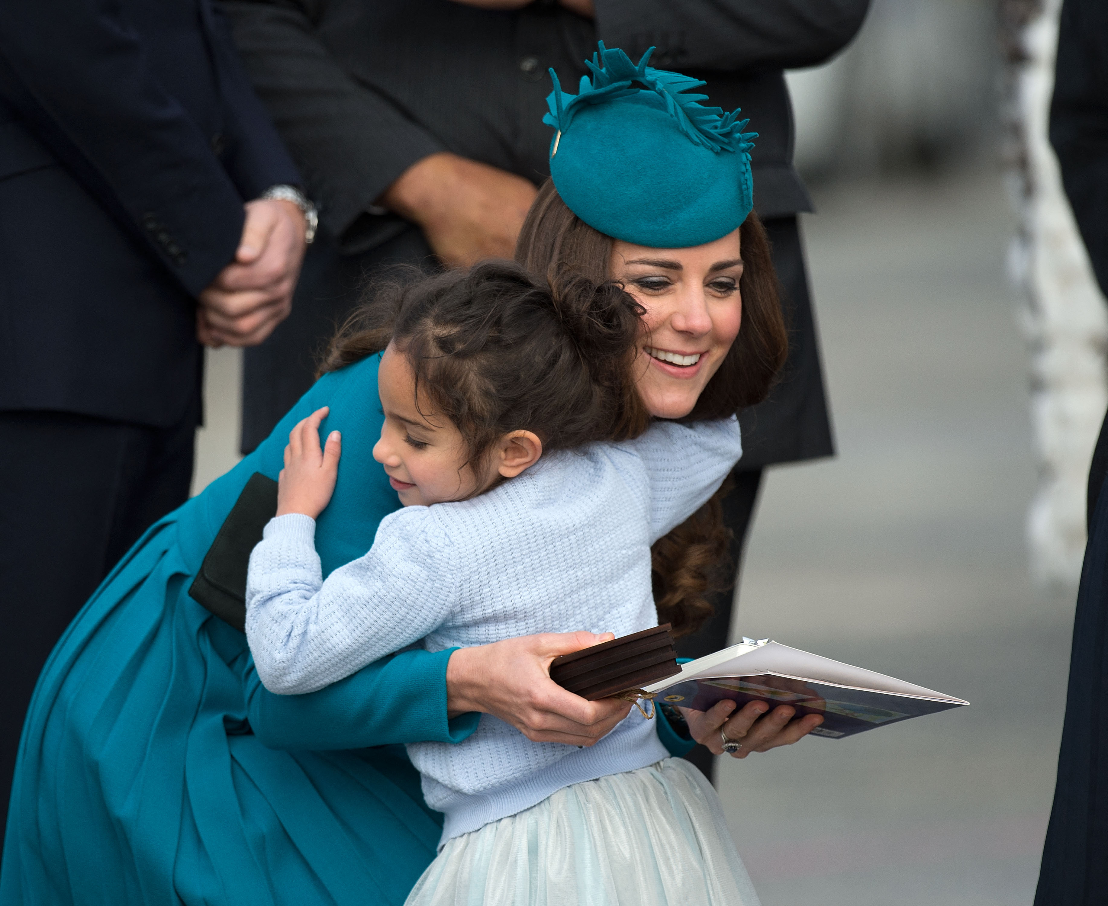Catherine the Duchess of Cambridge receives a hug from a little Girl during a Maori welcome at Dunedin airport in Dunedin on April 13, 2014. | Source: Getty Images