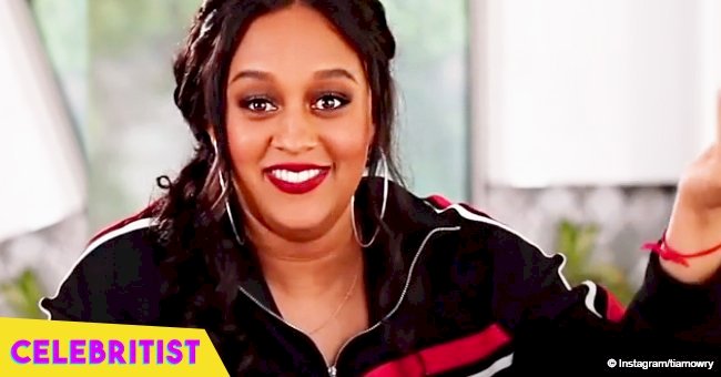 Tia Mowry stuns in green dress, holding daughter Cairo in yellow gown in new picture