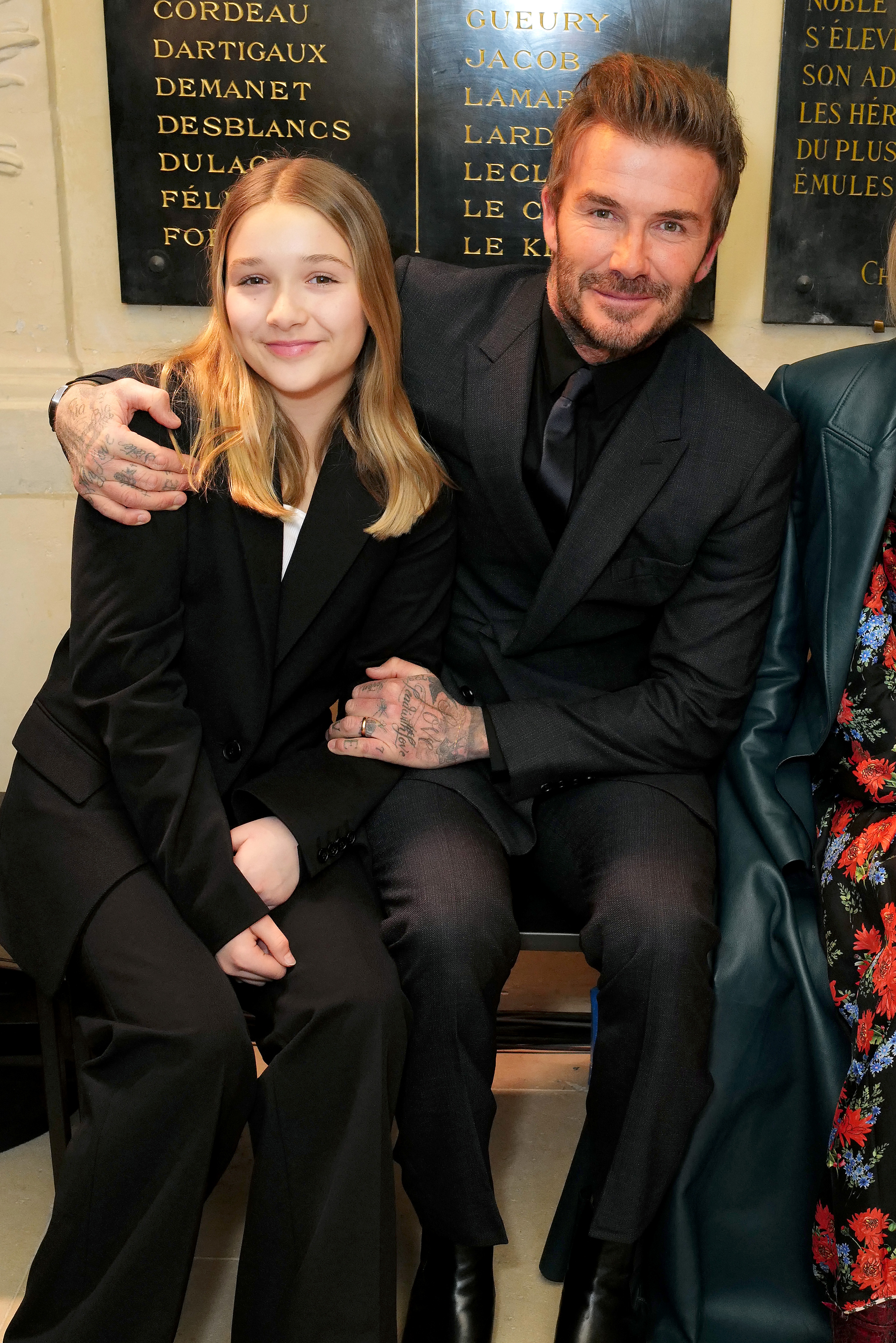 Harper and David Beckham at the Victoria Beckham FW23 show during Paris Fashion Week on March 3, 2023. | Source: Getty Images