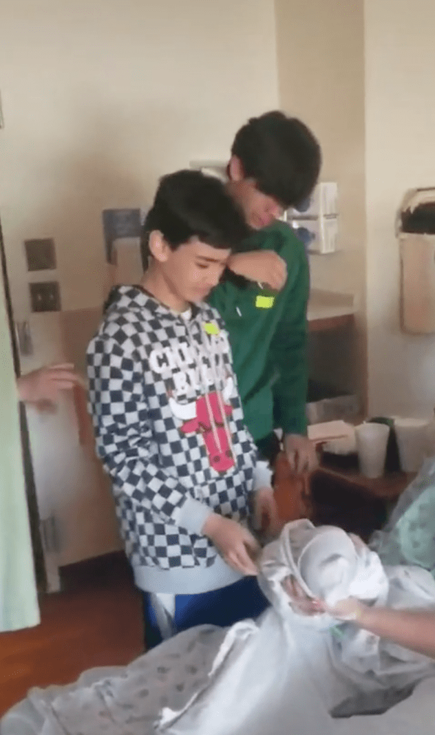 Two brothers are overcome with emotion after meeting their new sibling in the hospital | Photo: TikTok/fivedotmom