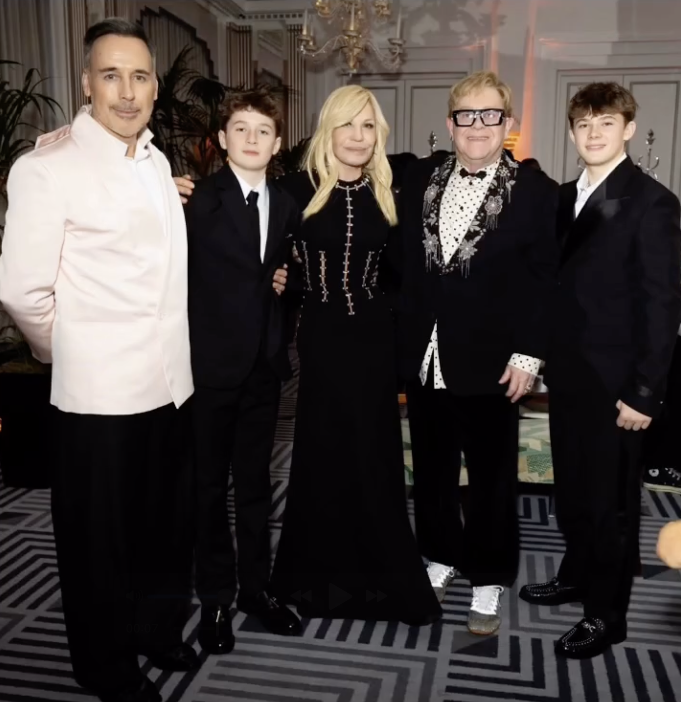Elton John poses with David Furnish, Donatella Versace, and their children, Zachary and Elijah, during a formal event | Source: Instagram/edward_enninful