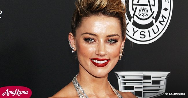 Johnny Depp's ex-wife Amber Heard flashes her slender body in bra-flashing red top