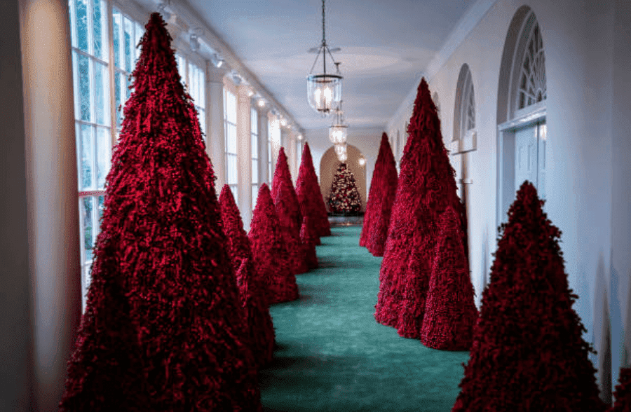 Red Christmas trees chosen by Melania Trump for Christmas decorations line the East Colonnade of the White House, on Monday, Nov. 26, 2018, in Washington, DC | Source: Jabin Botsford/The Washington Post via Getty Images