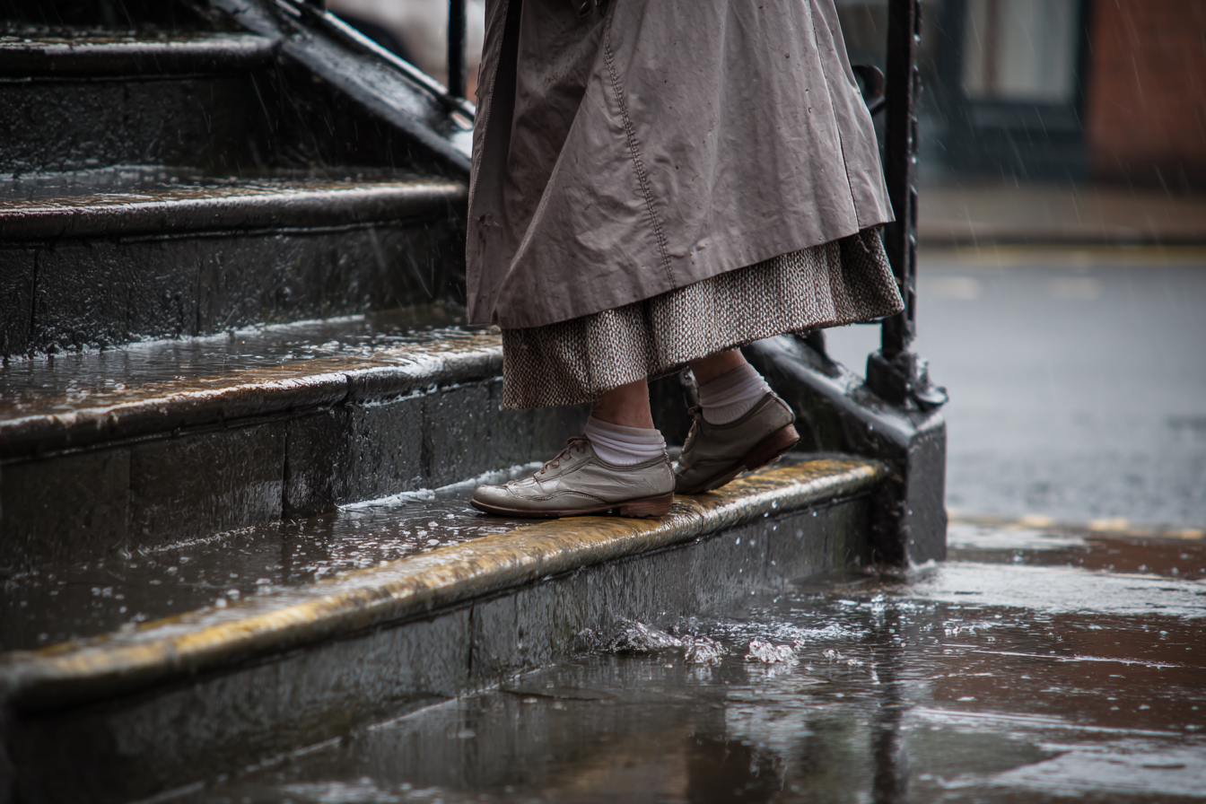 A woman climbing the stairs | Source: Midjourney