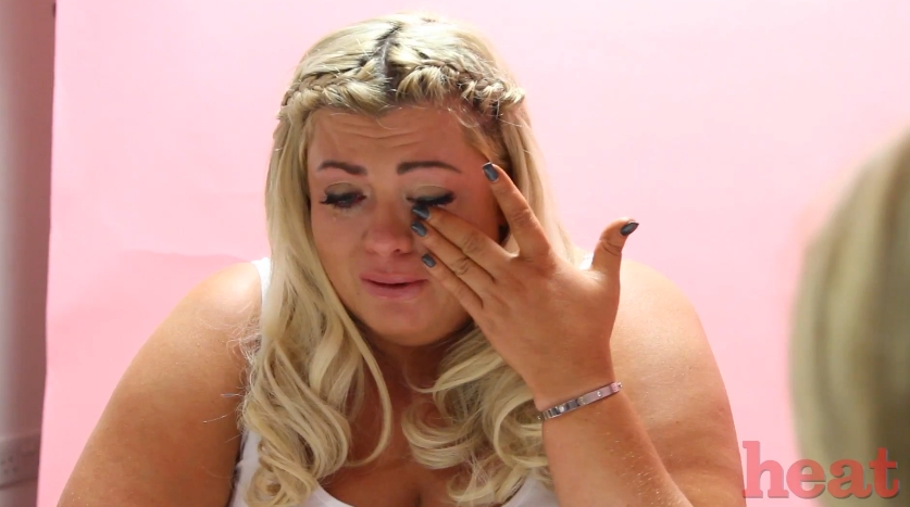 Collins pauses mid-conversation to wipe her eye, dark mascara tracing a path down her cheek as she tries to hold herself together. The silver bracelet on her wrist catches the light as her hand rises, a small, quiet detail in an otherwise deeply personal moment. For a woman so often reduced to a punchline, this interview stood as something the public had rarely been given the chance to see. | Source: YouTube/heatworld