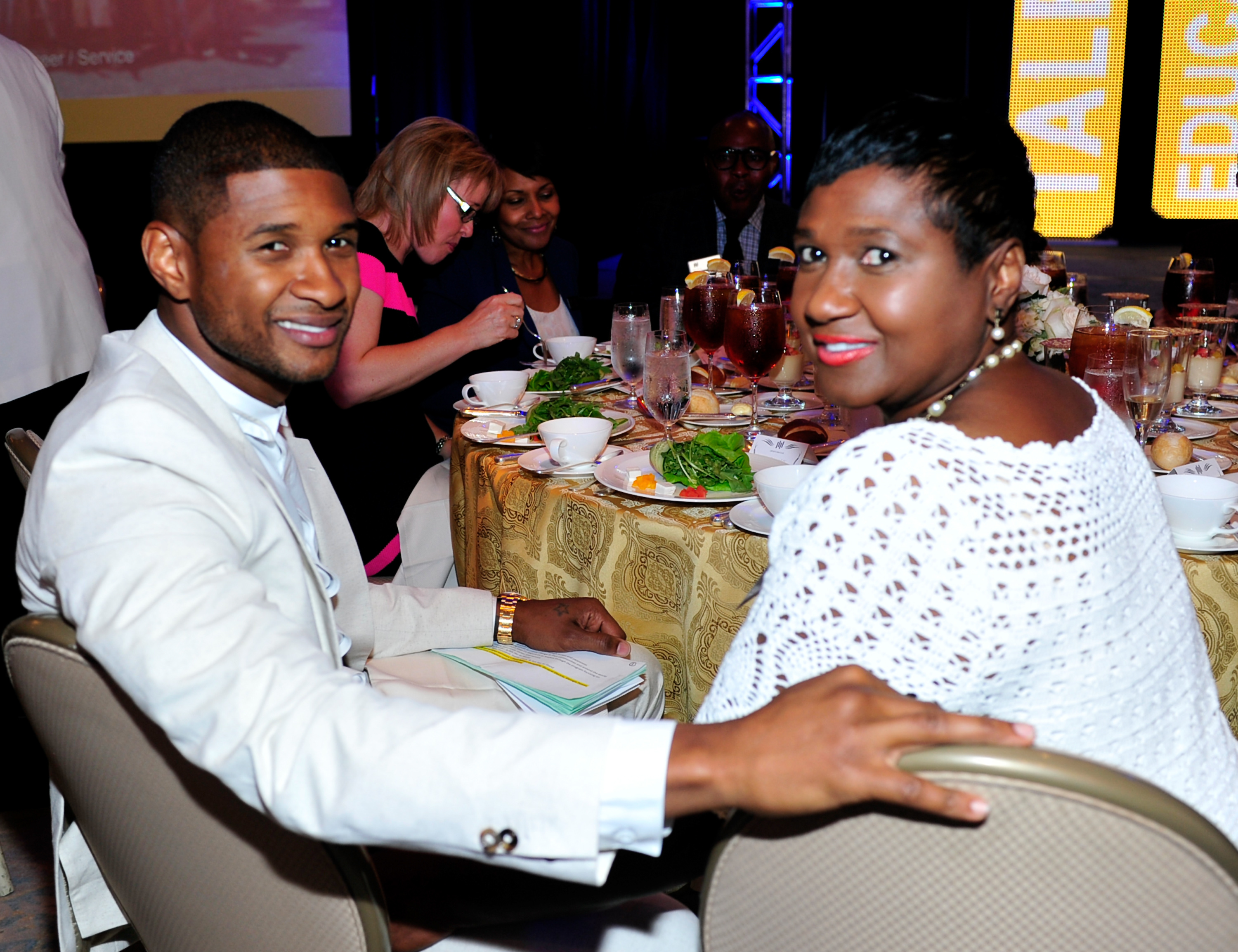 Usher and Jonnetta Patton at the President's Circle Awards Luncheon on July 31, 2014, in Atlanta, Georgia. | Source: Getty Images