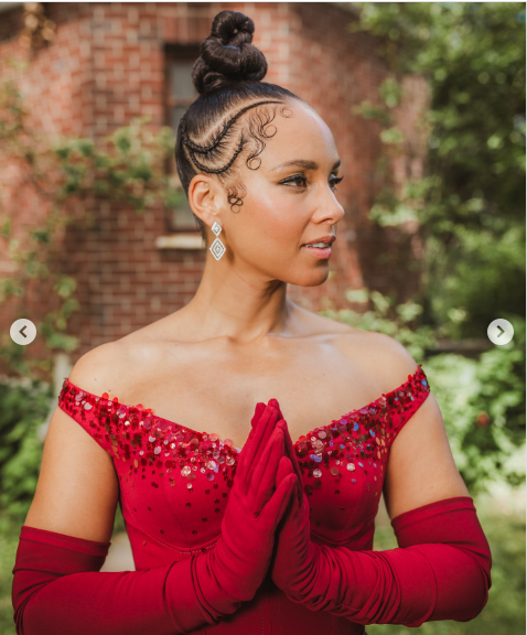 Alicia Keys posing in an elegant bold red outfit | Source: Instagram/aliciakeys
