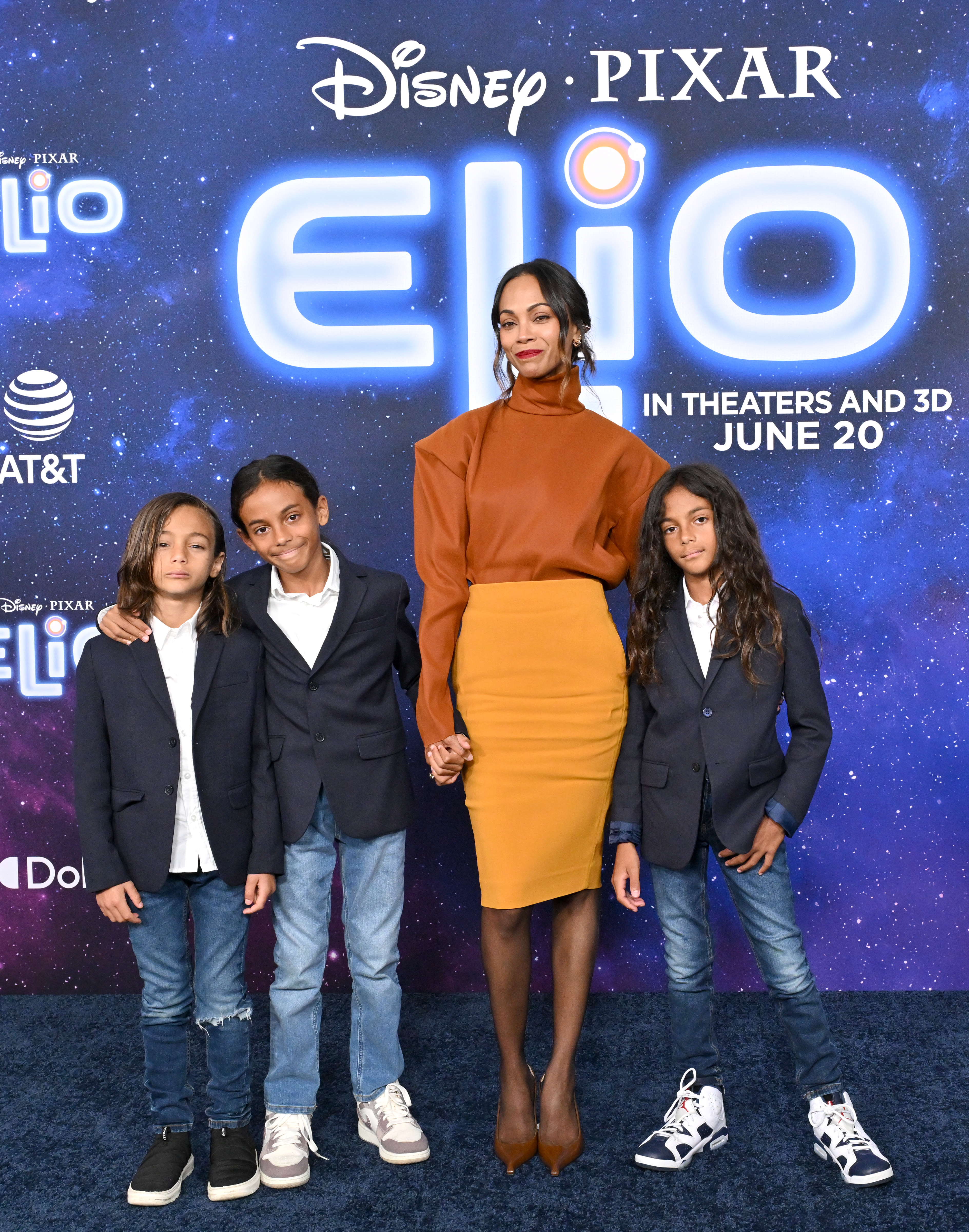 Zoe Saldaña and her sons Cy, Bowie, and Zen Perego-Saldaña on the red carpet of the Los Angeles premiere of Disney Pixar's "Elio"
