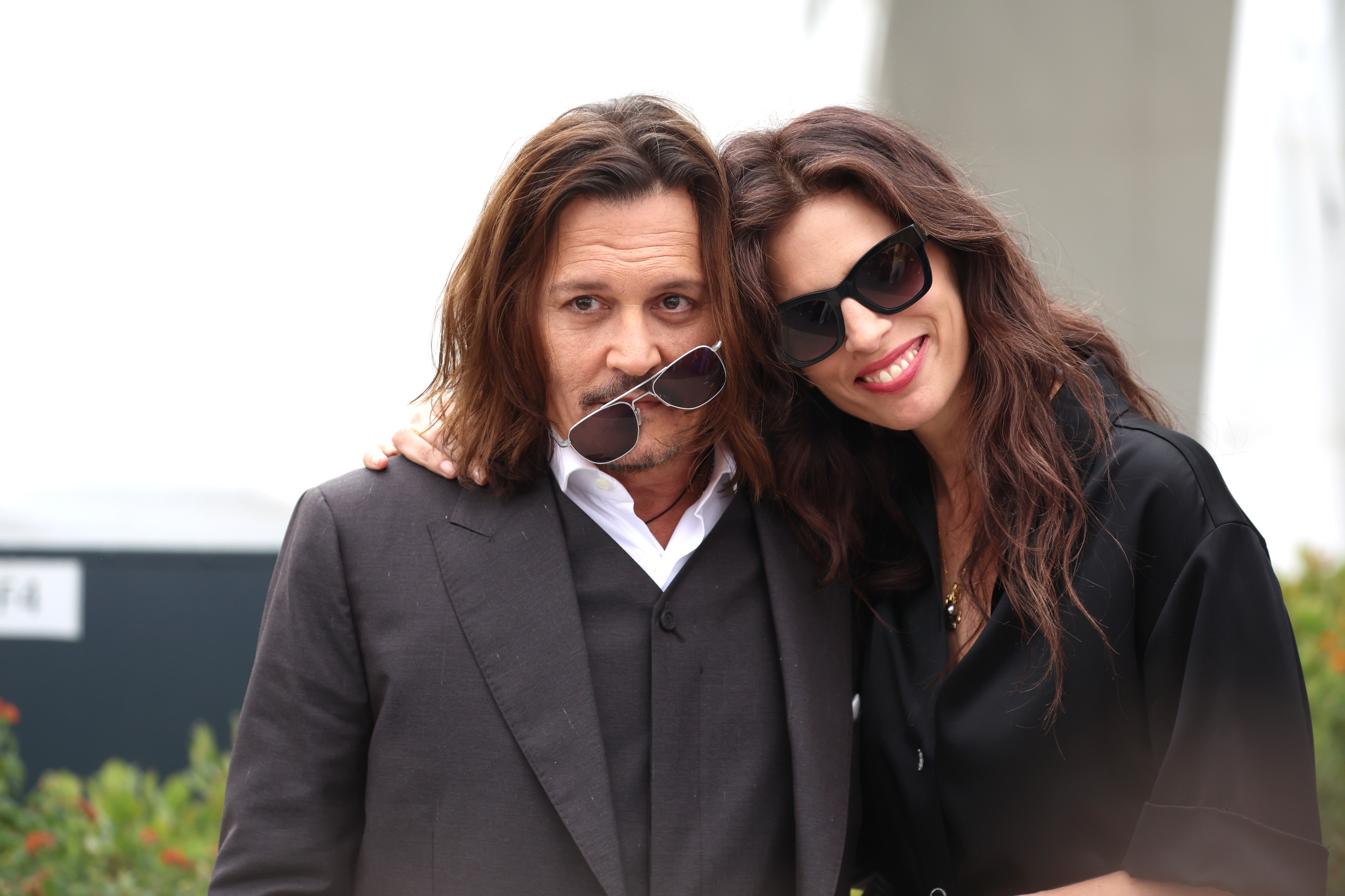Johnny Depp and Maiwenn attend the "Jeanne du Barry" photocall at the 76th annual Cannes film festival at Palais des Festivals o,n May 17, 2023, in Cannes, France | Source: Getty Images