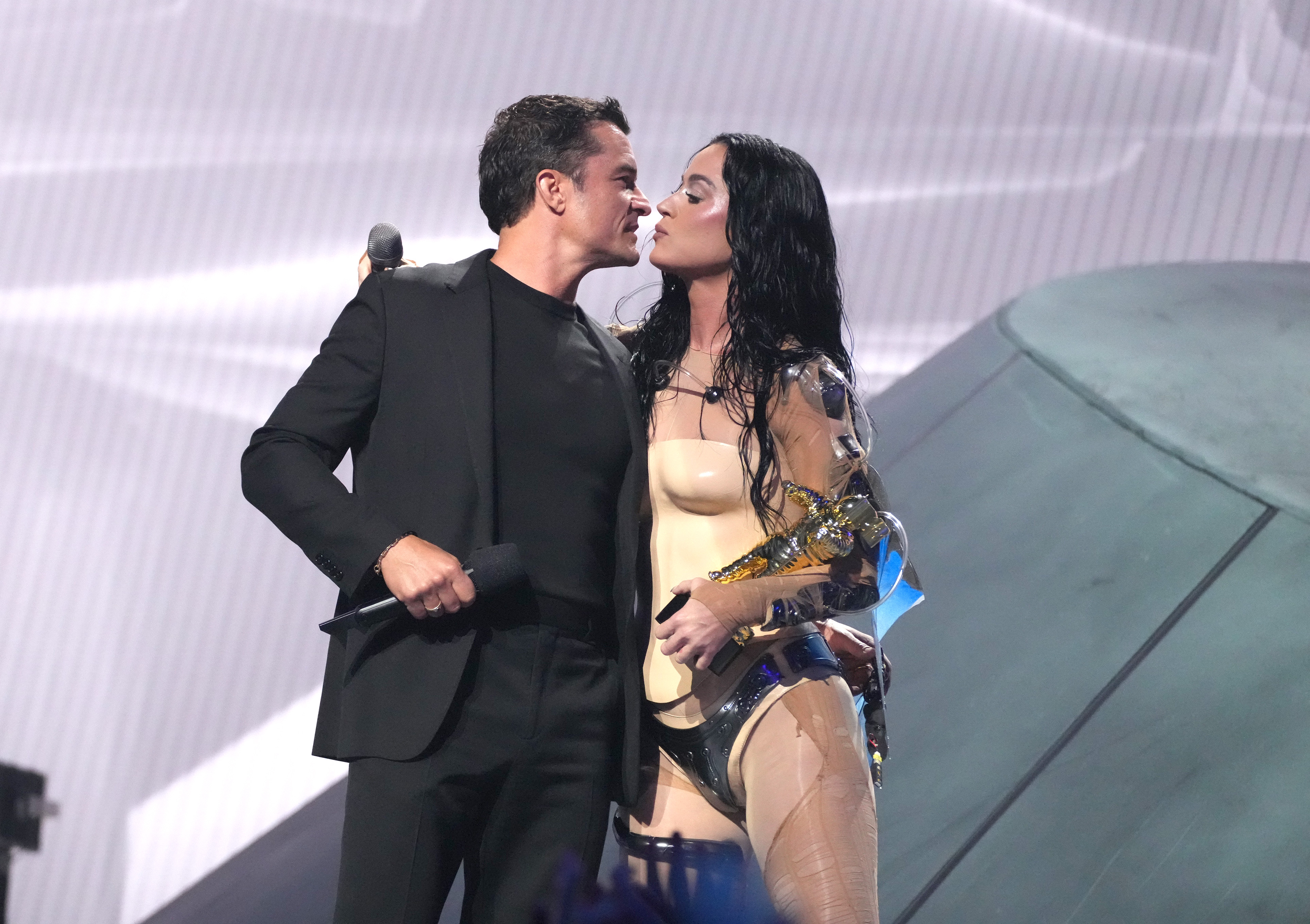 Katy Perry accepts the MTV Video Vanguard award from Orlando Bloom on stage during the 2024 MTV Video Music Awards in Elmont, New York, on September 11, 2024 | Source: Getty Images