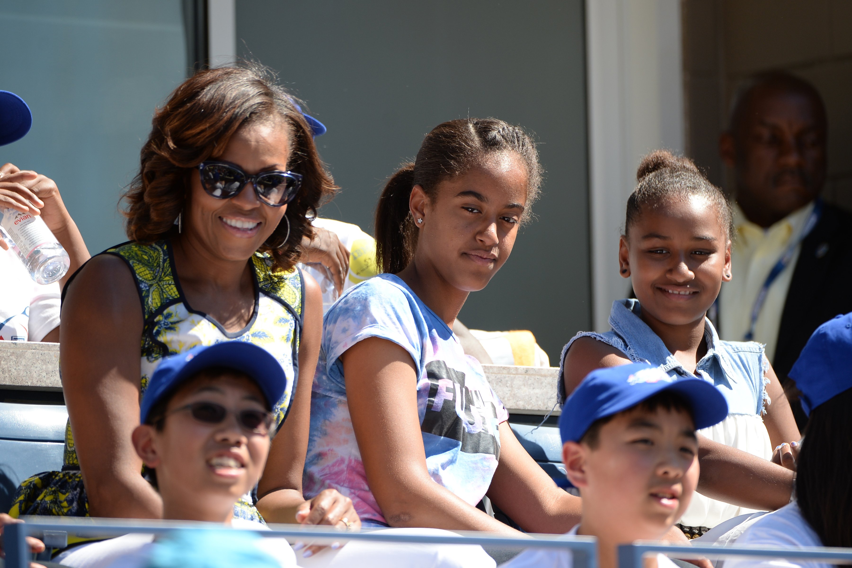 Michelle Obama & daughters Sasha and Malia at the Arthur Ashe Kids Day on Aug. 24, 2013 in New York City | Photo: Getty Images
