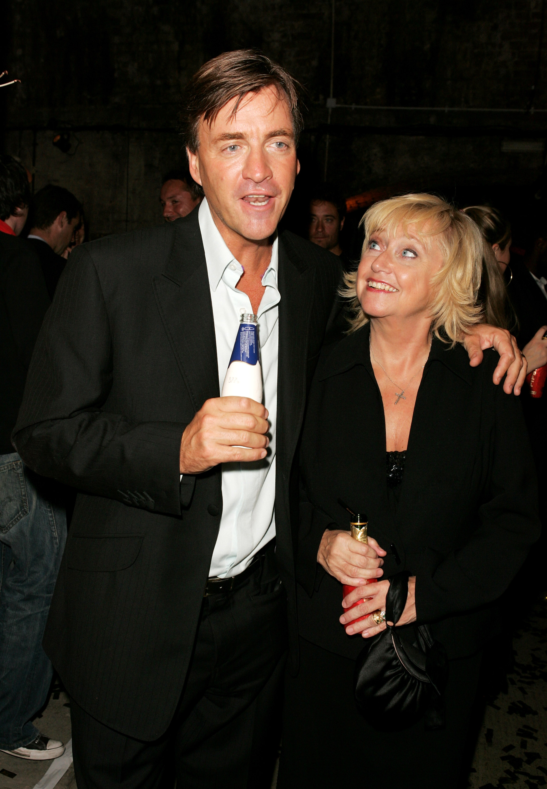 Judy Finnigan and Richard Madeley are pictured at the MORE4 launch party in London on 6 October 2005, standing close amid the buzz of the evening as they continued to navigate the evolving media landscape together, their easy rapport and shared presence still unmistakable years after their daytime television peak.