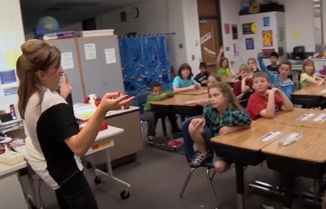 Conjoined twin Abby Hensel teaching a class | Source: YouTube/Screen Static