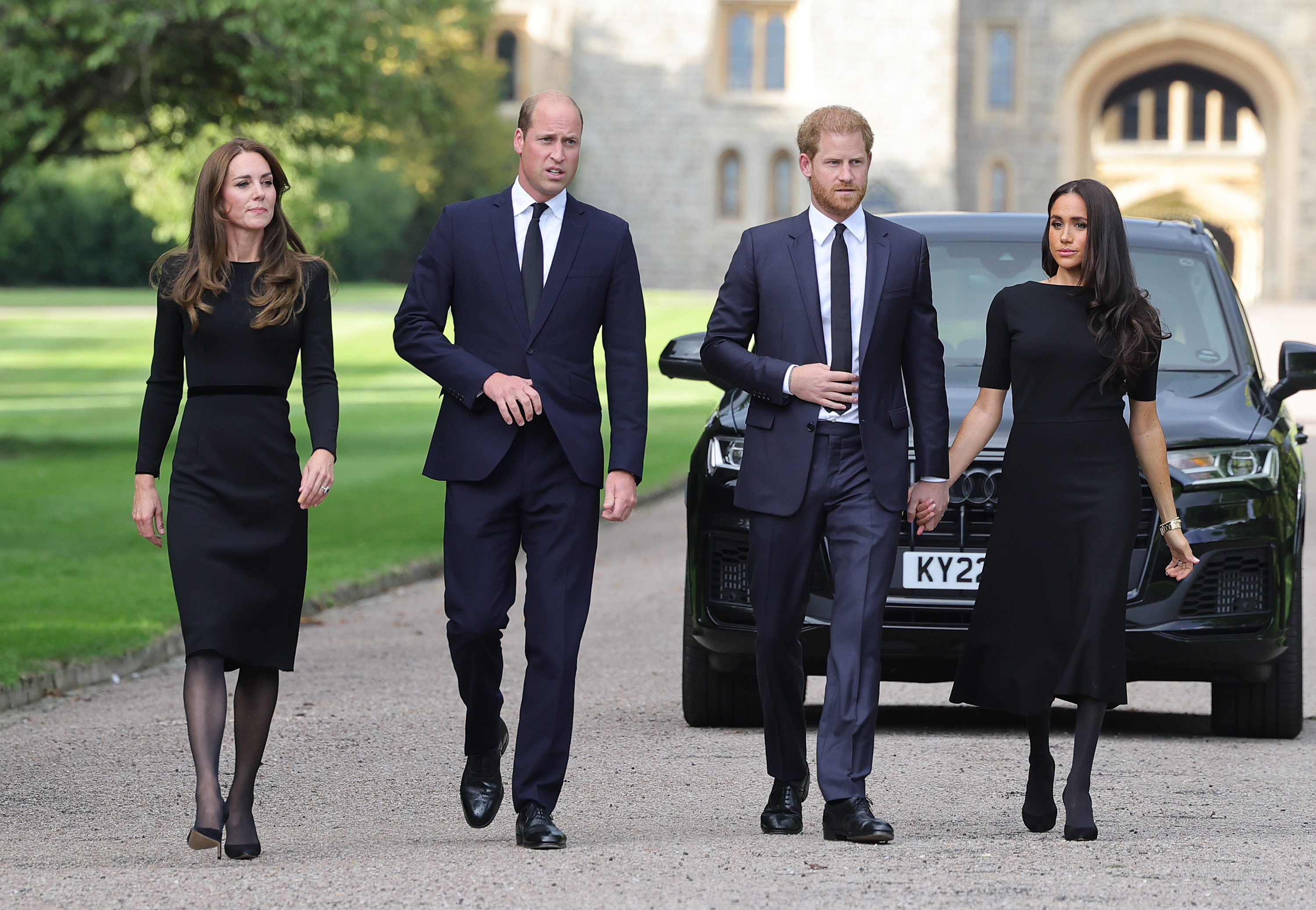 Catherine, Princess of Wales, Prince William, Prince of Wales, Prince Harry, Duke of Sussex, and Meghan, Duchess of Sussex arriving to view flowers and tributes to Queen Elizabeth II on September 10, 2022 in Windsor, England | Source: Getty Images