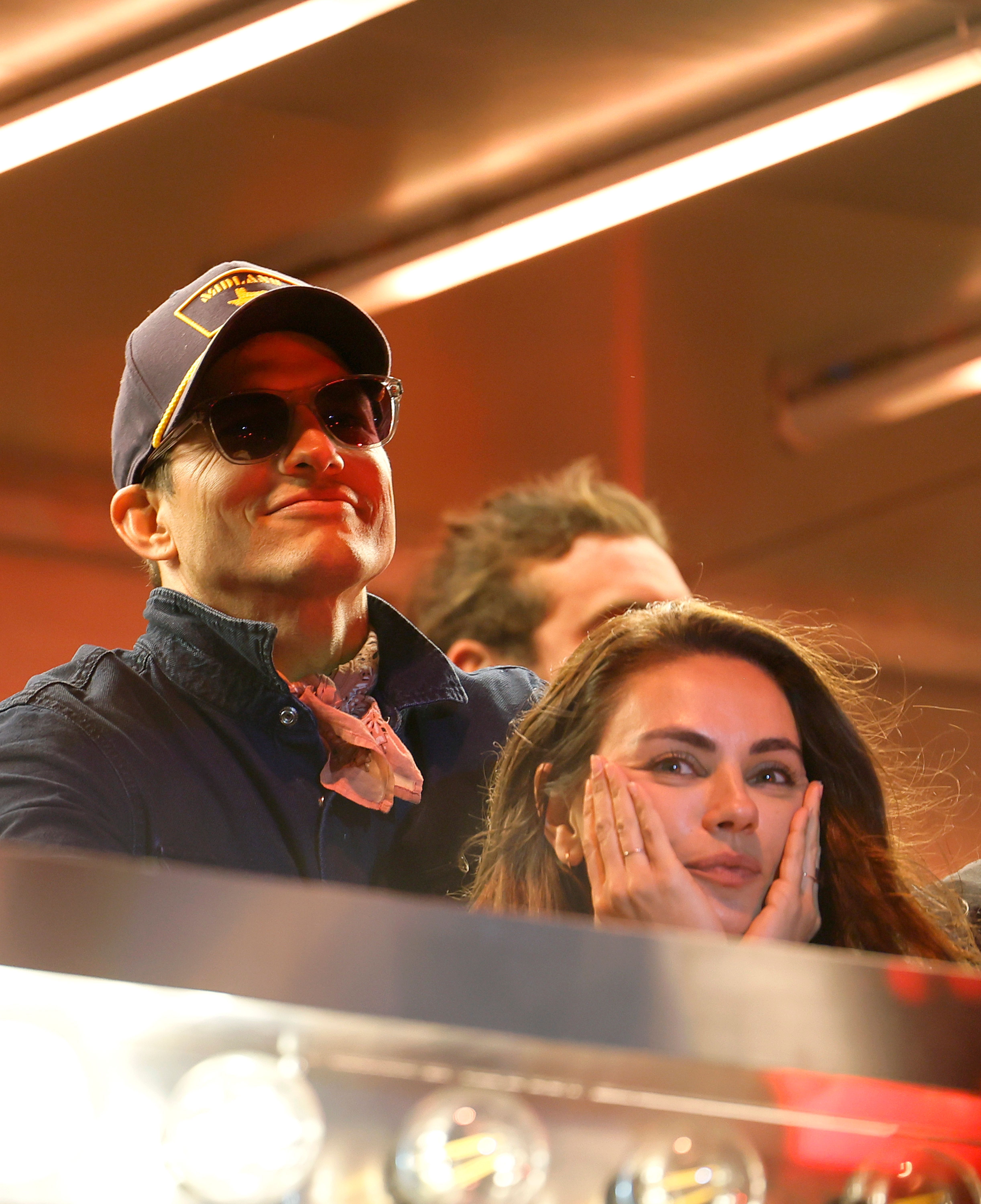Mila Kunis  and Ashton Kutcher are seen onstage at the T-Mobile Mane Stage during the Stagecoach Festival in Indio, California on April 27, 2025 | Source: Getty Images