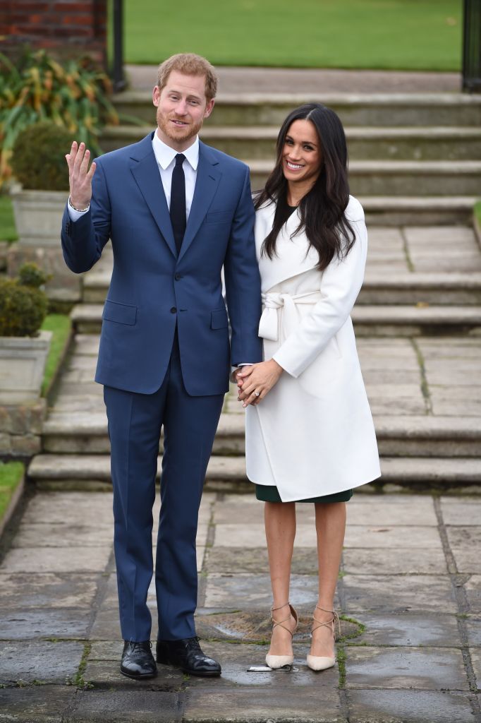 Prince Harry and actress Meghan Markle during an official photocall to announce their engagement at The Sunken Gardens at Kensington Palace | Photo: Getty Images