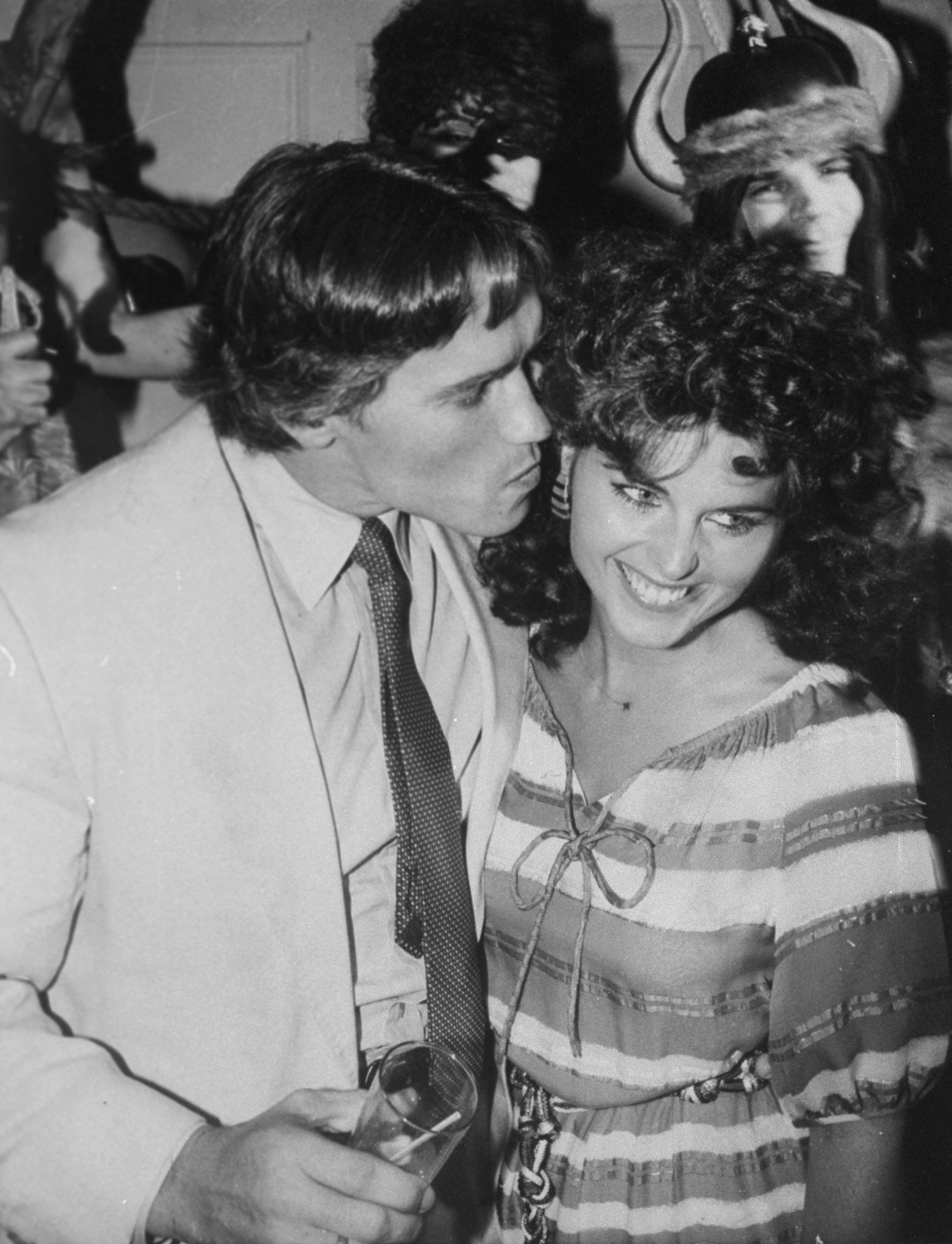 Arnold Schwarzenegger kisses Maria Shriver at a party on May 17, 1982 | Source: Getty Images