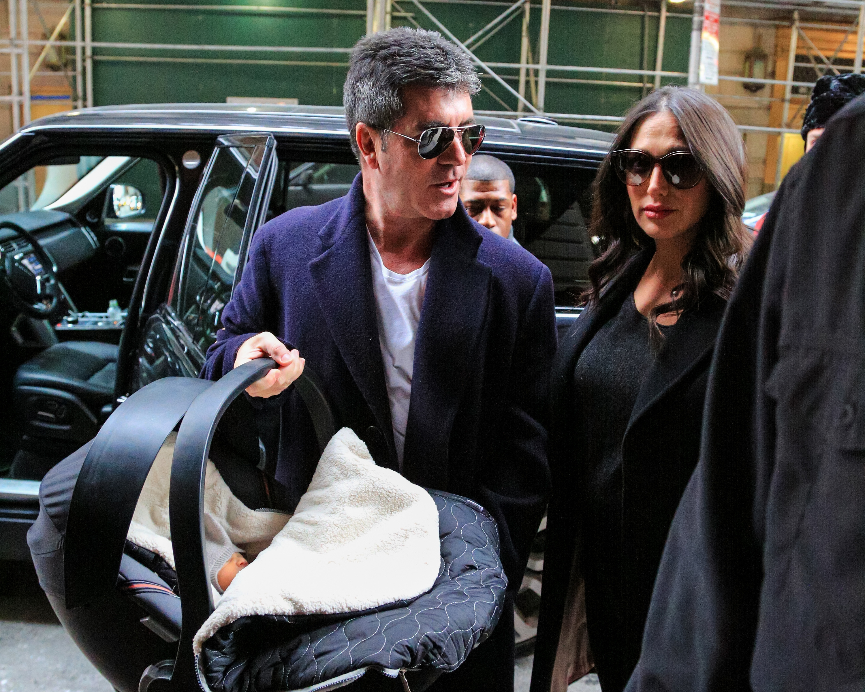 Simon Cowell with Lauren Silverman and their son Eric Cowell seen arriving at their hotel on February 16, 2014 in New York City | Source: Getty Images