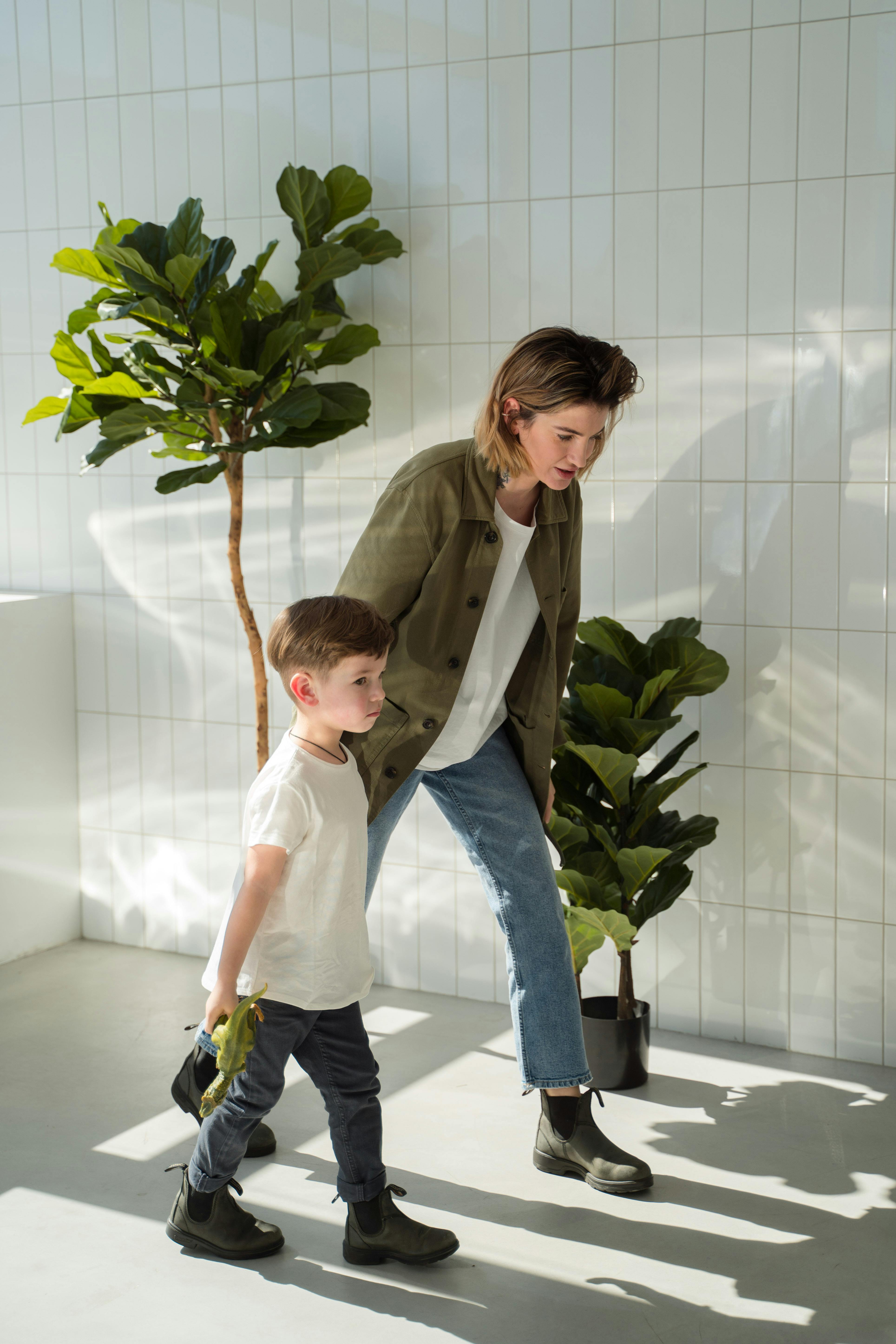 A woman walking with a boy | Source: Pexels