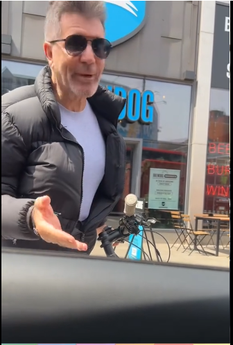 Simon Cowell spotted by fans while riding him electric bike in Central London from a video posted on June 22, 2025 | Source: Tiktok/@plus44unrulyfluffy