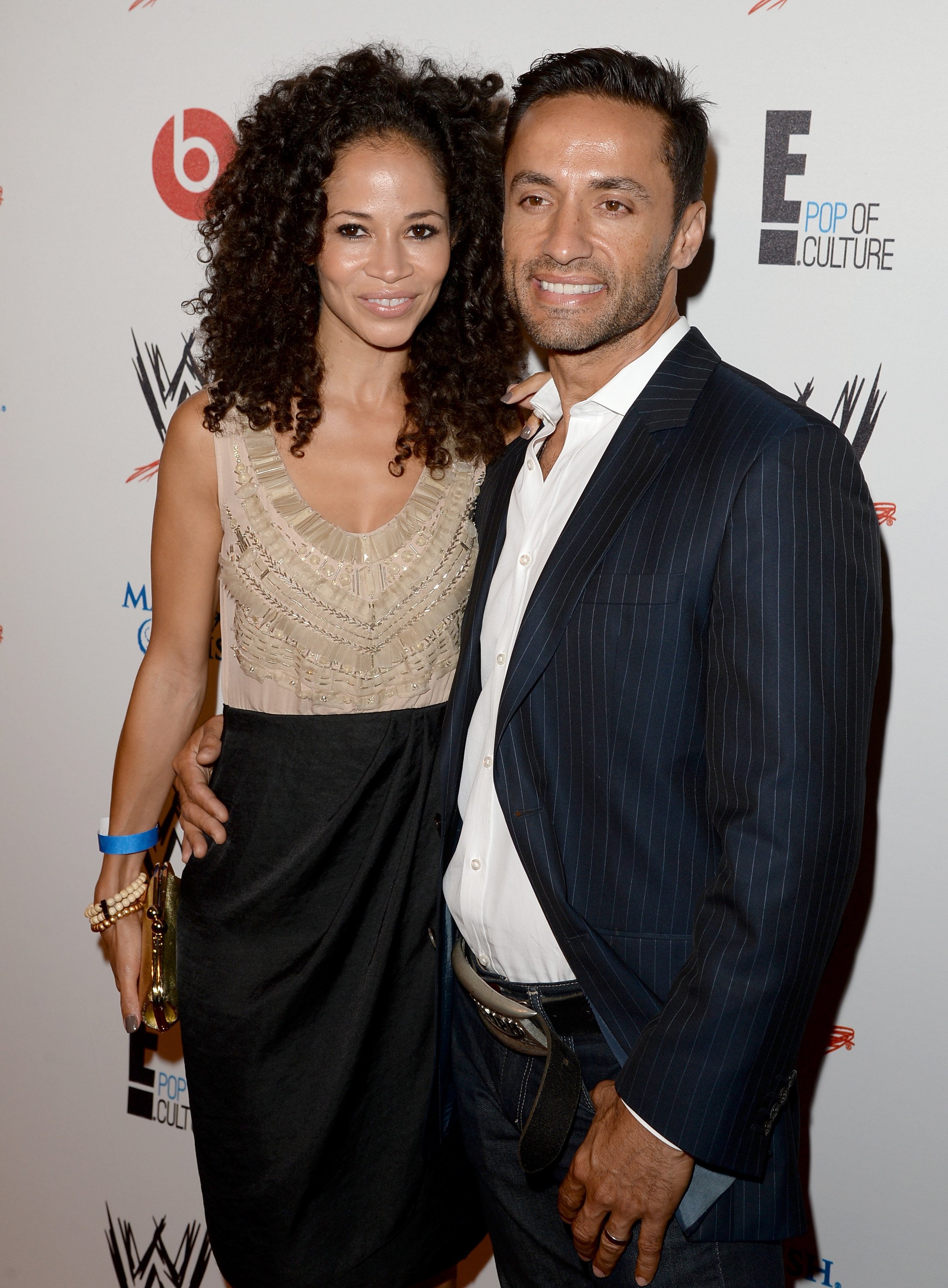 Sherri Saum (L) and Kamar de los Reyes attends WWE & E! Entertainment's "SuperStars For Hope" at the Beverly Hills Hotel on August 15, 2013, in Beverly Hills, California. | Source: Getty Images.