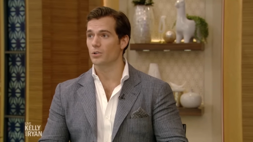 Henry Cavill listened intently as he spoke with Kelly Ripa and Ryan Seacrest during his studio interview, which later resurfaced online years after it first aired. | Source: YouTube/LiveKellyandMark