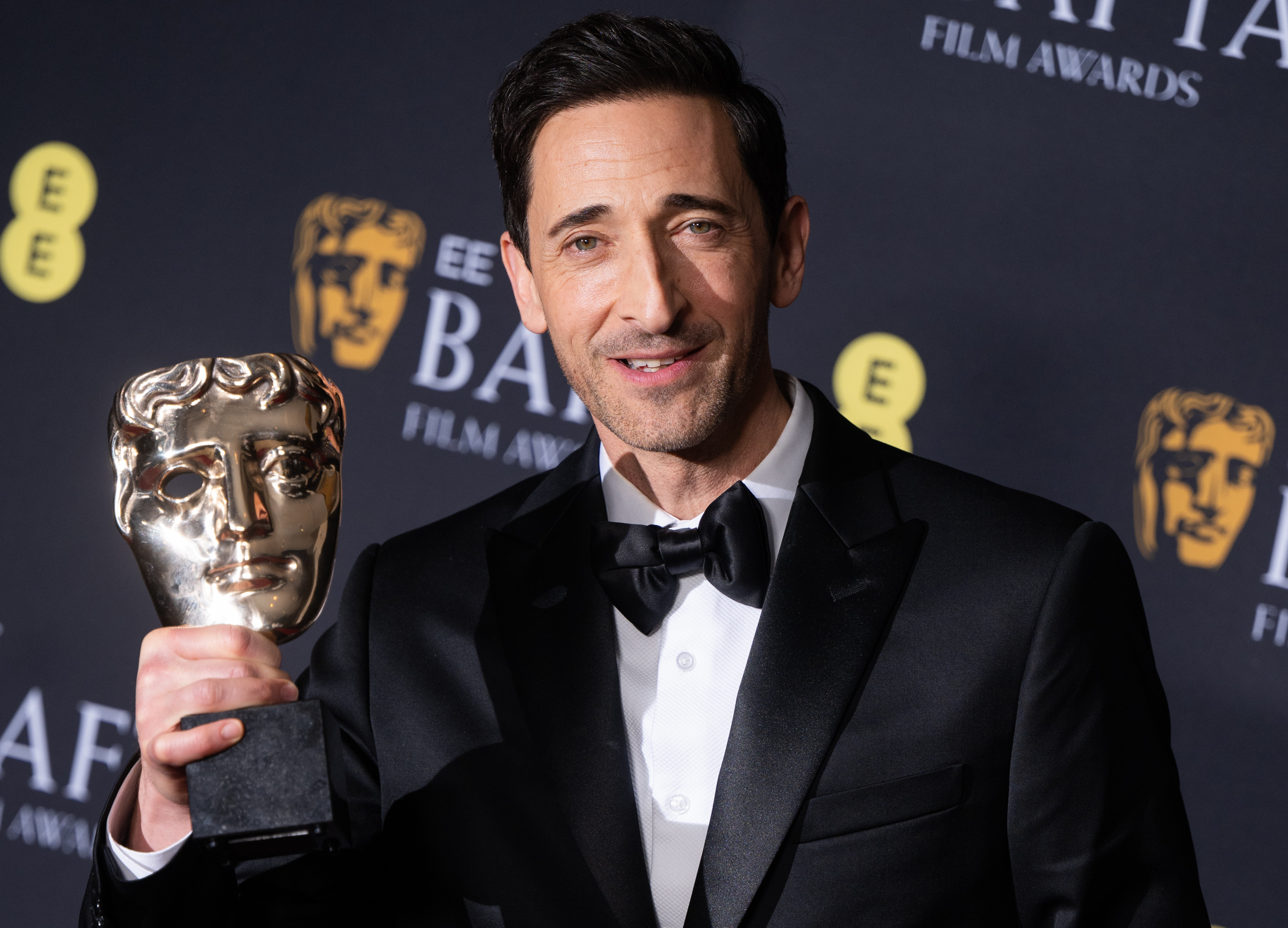 Adrien Brody poses with his Leading Actor Award for "The Brutalist" in the winners room during the 2025 EE BAFTA Film Awards on February 16, 2025 | Source: Getty Images