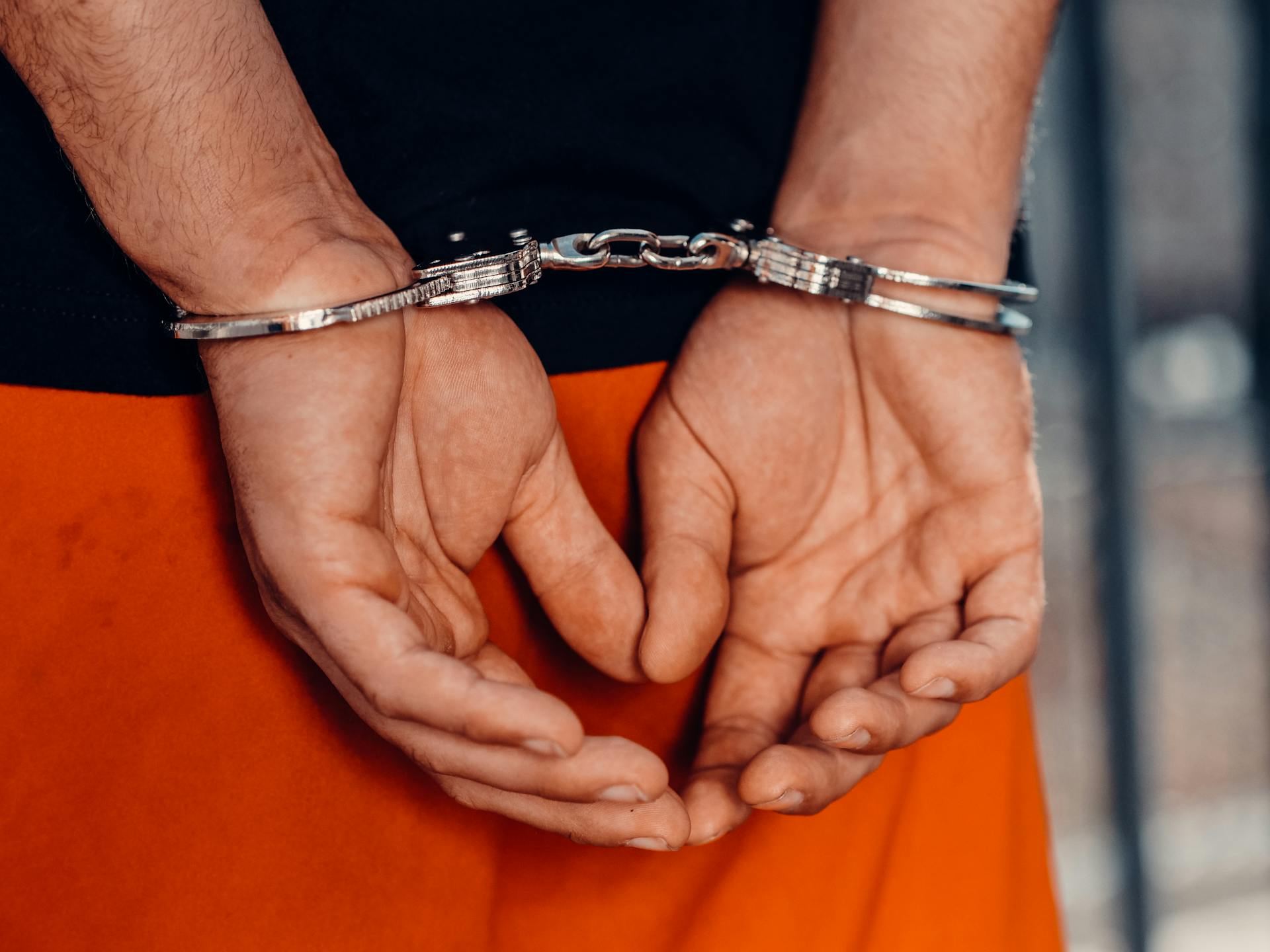 Close-up shot of a man with handcuffs | Source: Pexels