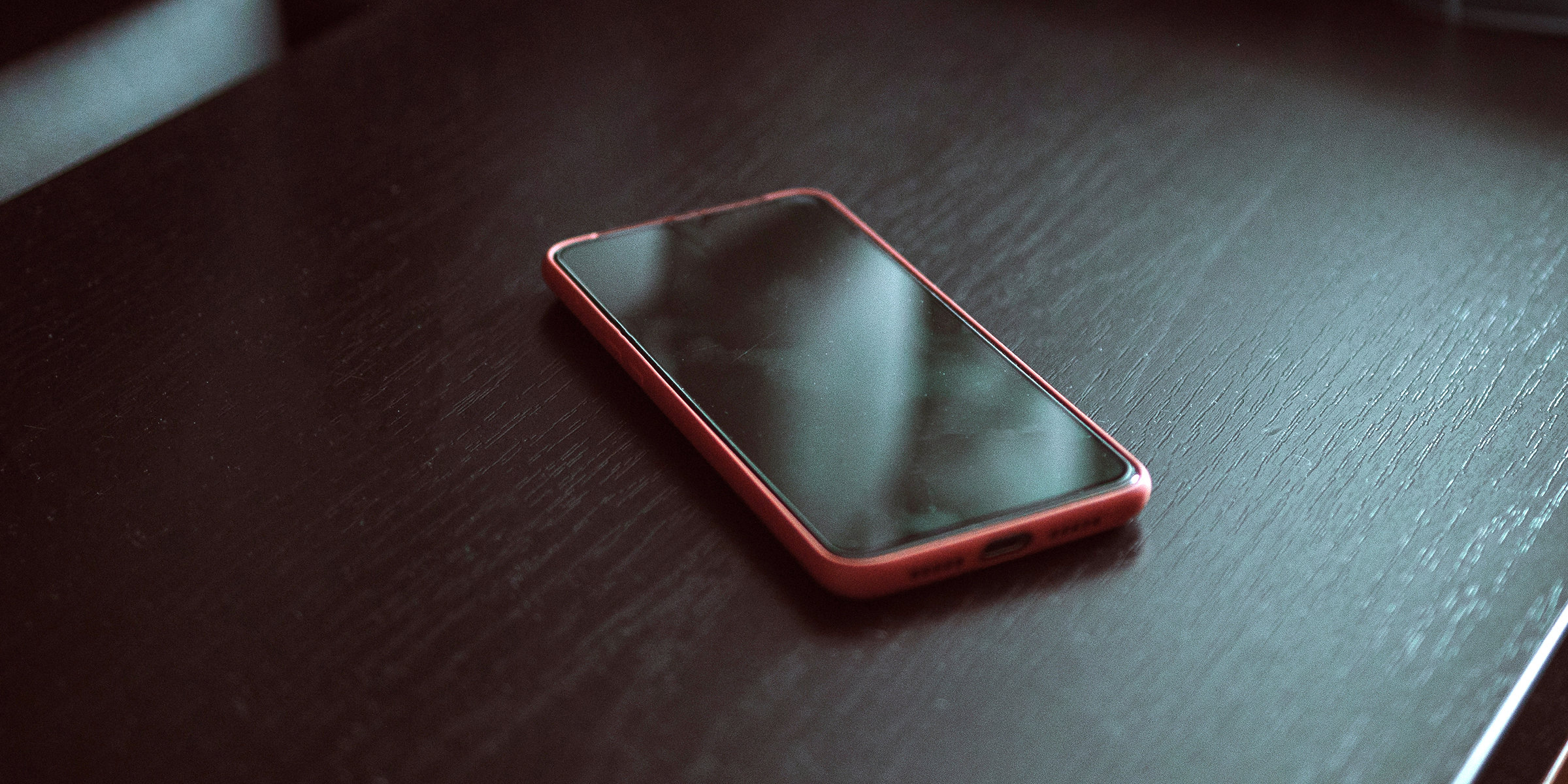 A cellphone on a table | Source: Shutterstock