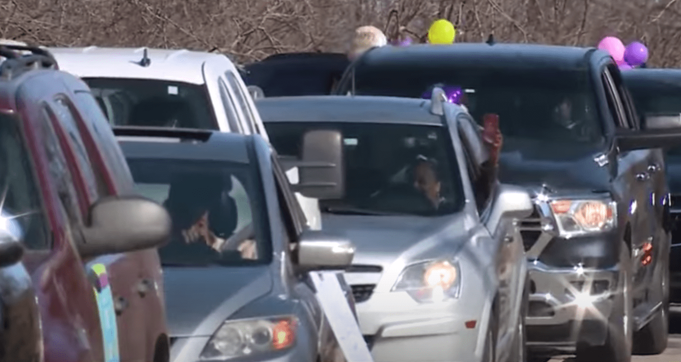 People drive during a birthday parade for 103-year-old woman Della Hathorne who beat COVID-19 on January 30, 20201. | Source: YouTube/KOCO5News