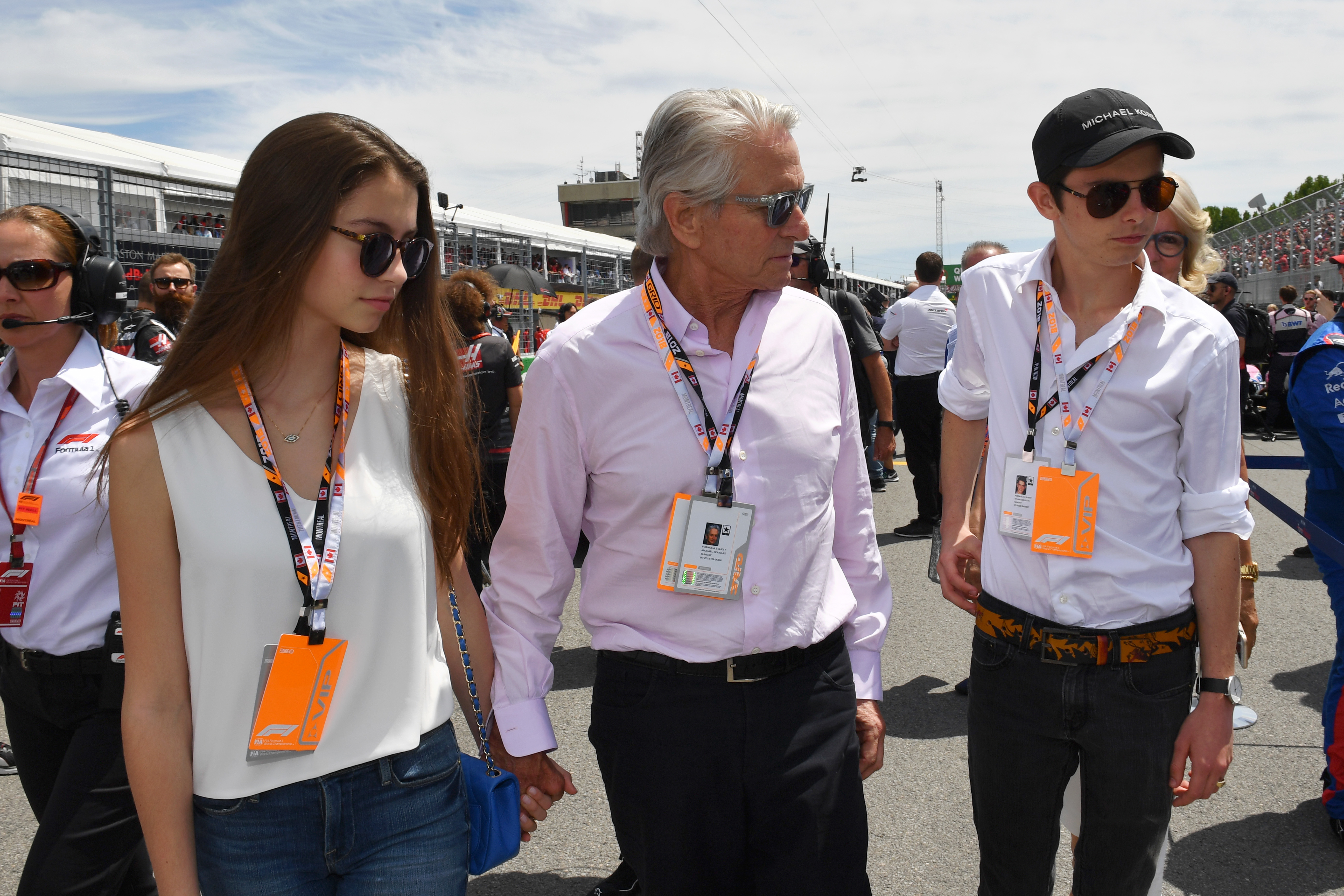 Michael Douglas (USA) with his son Dylan Douglas (USA) and daughter Carys Zeta-Douglas (USA) on the grid during the Canadian GP at Circuit Gilles-Villeneuve on June 10, 2018, in Circuit Gilles-Villeneuve, Canada | Source: Getty Images