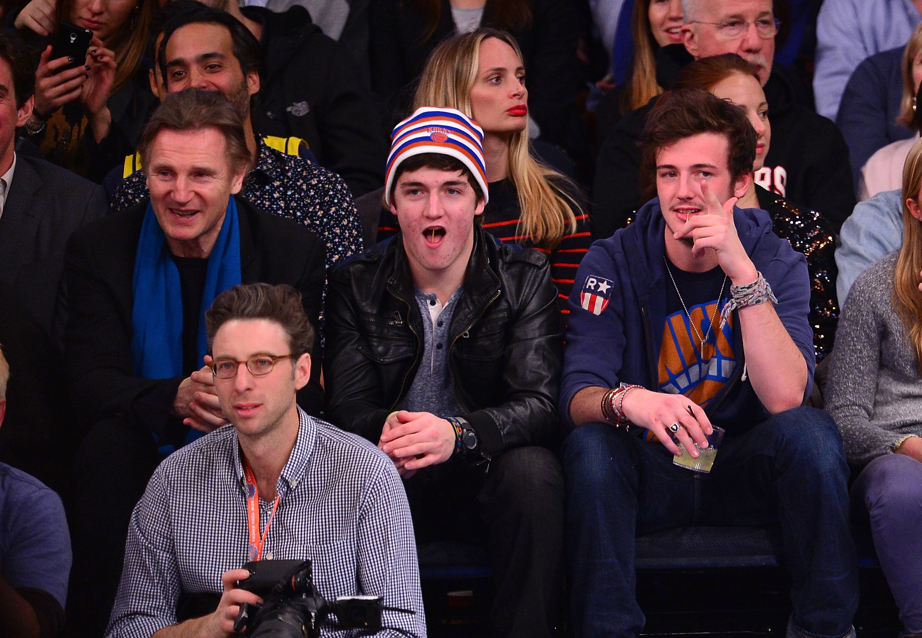 Liam Neeson, Daniel Neeson and Michael Neeson attend the Miami Heat vs New York Knicks game at Madison Square Garden on January 9, 2014 in New York City. | Source: Getty Images