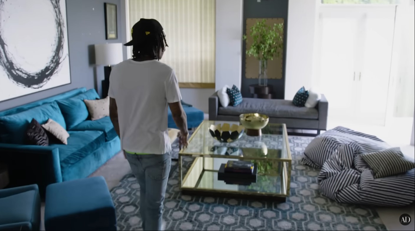 Wiz Khalifa walks through the spacious living room of his Los Angeles home during the Architectural Digest house tour. | Source: YouTube/Architectural Digest