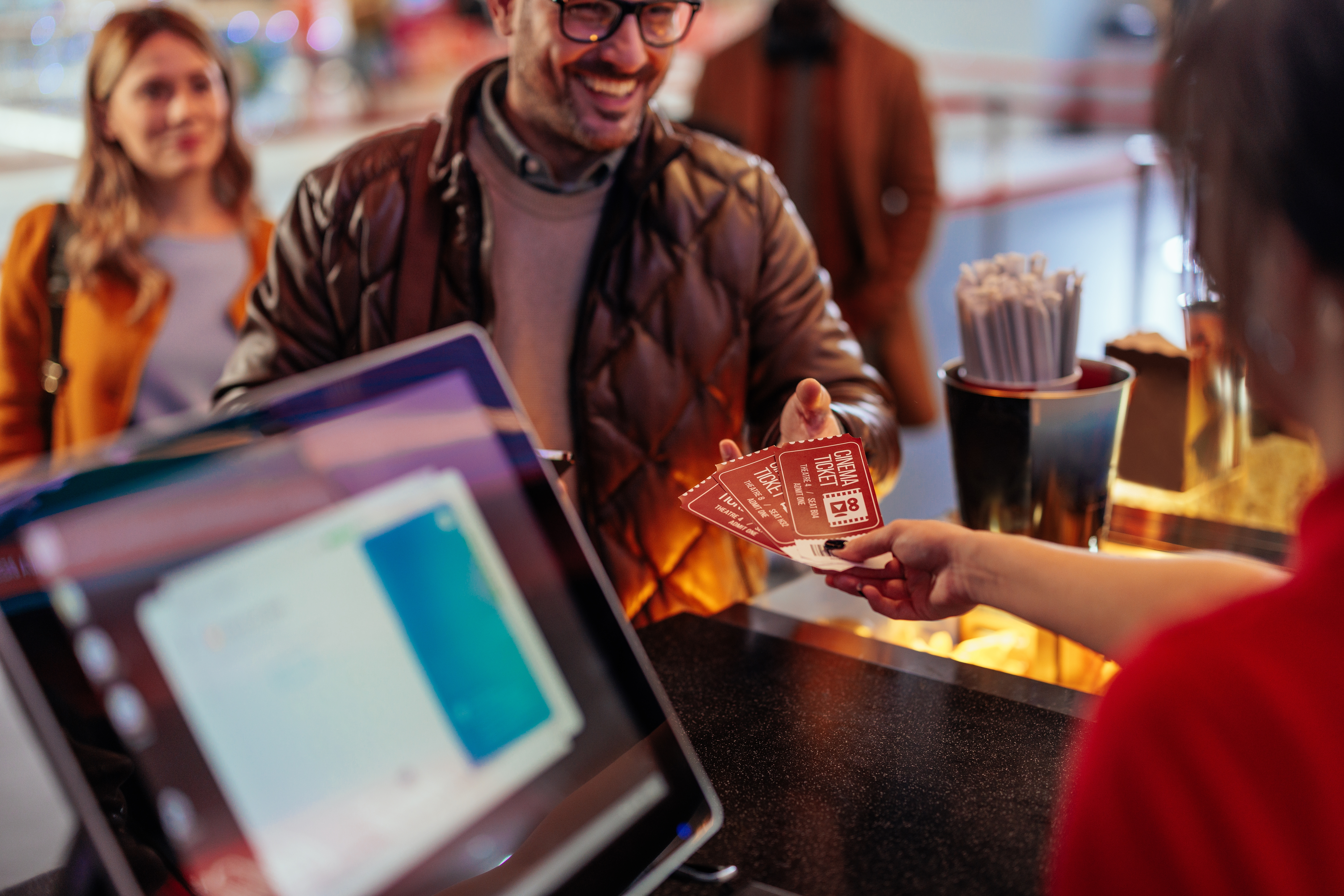 A man buying movie tickets | Source: Shutterstock