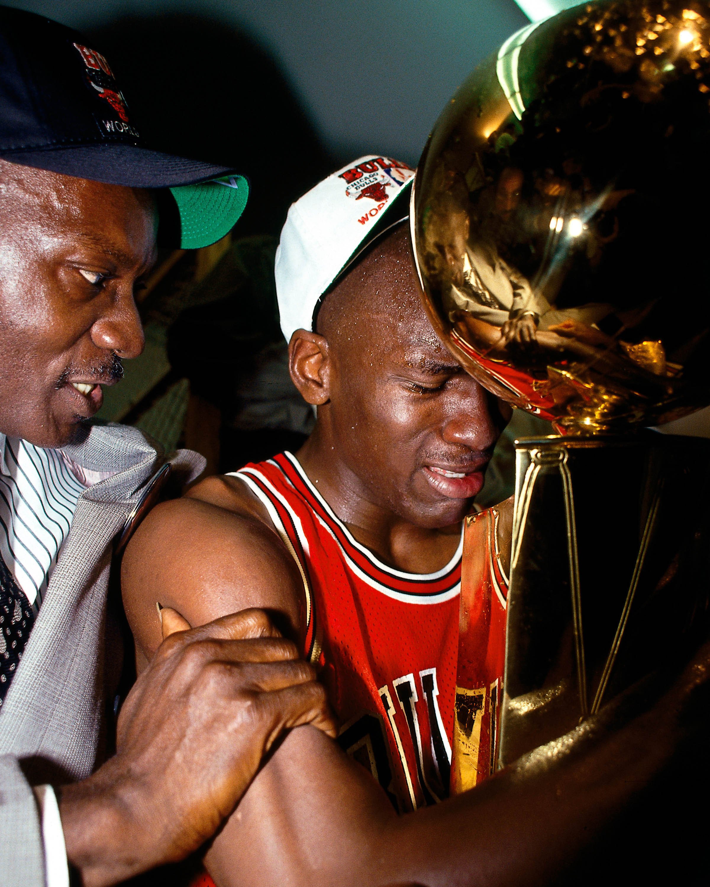 Michael Jordan celebrates with his father James Jordan in the locker room after winning Game 5 the 1991 NBA Championship. | Source: Getty Images