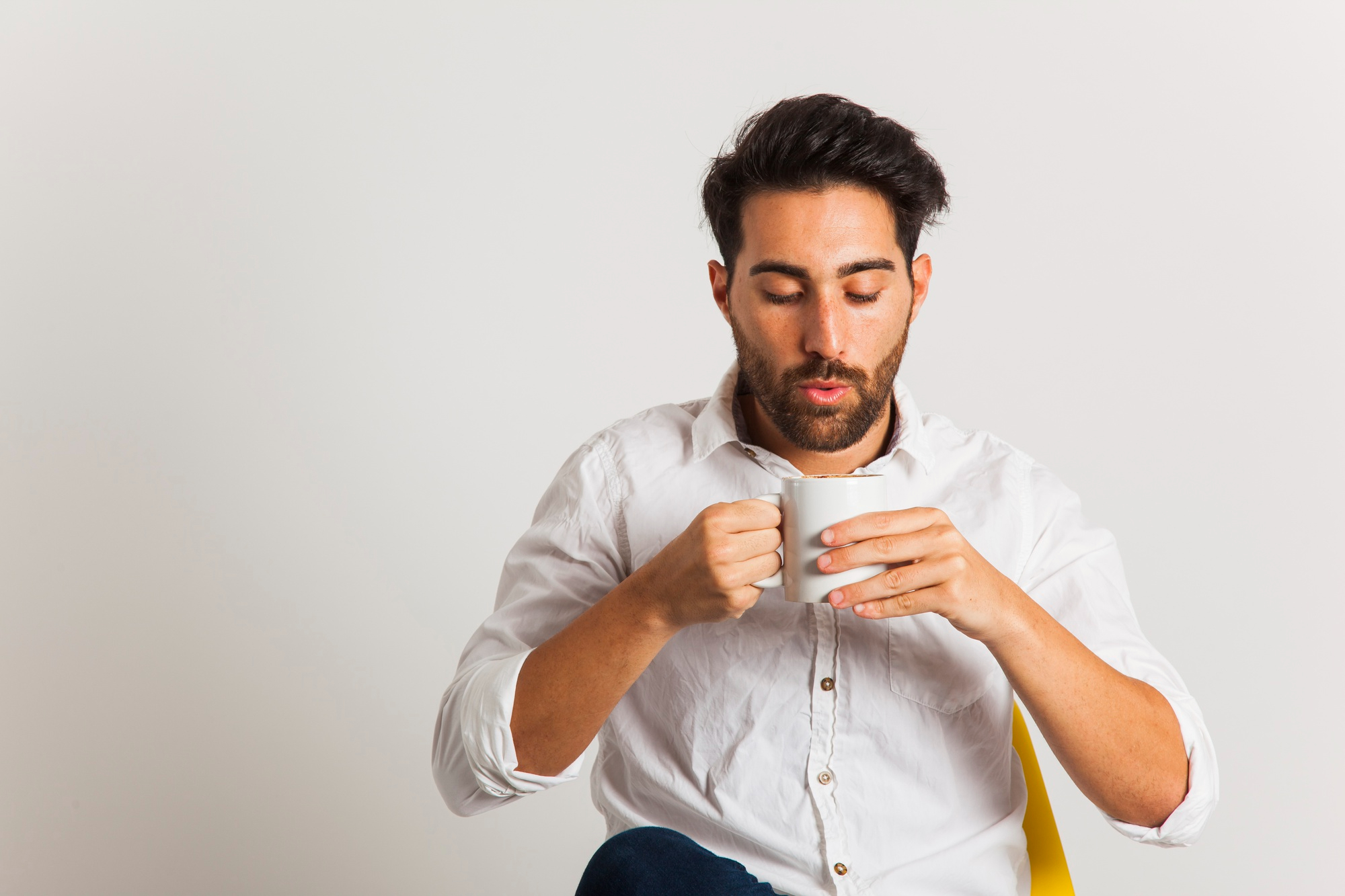 A man about to drink coffee | Source: Freepik