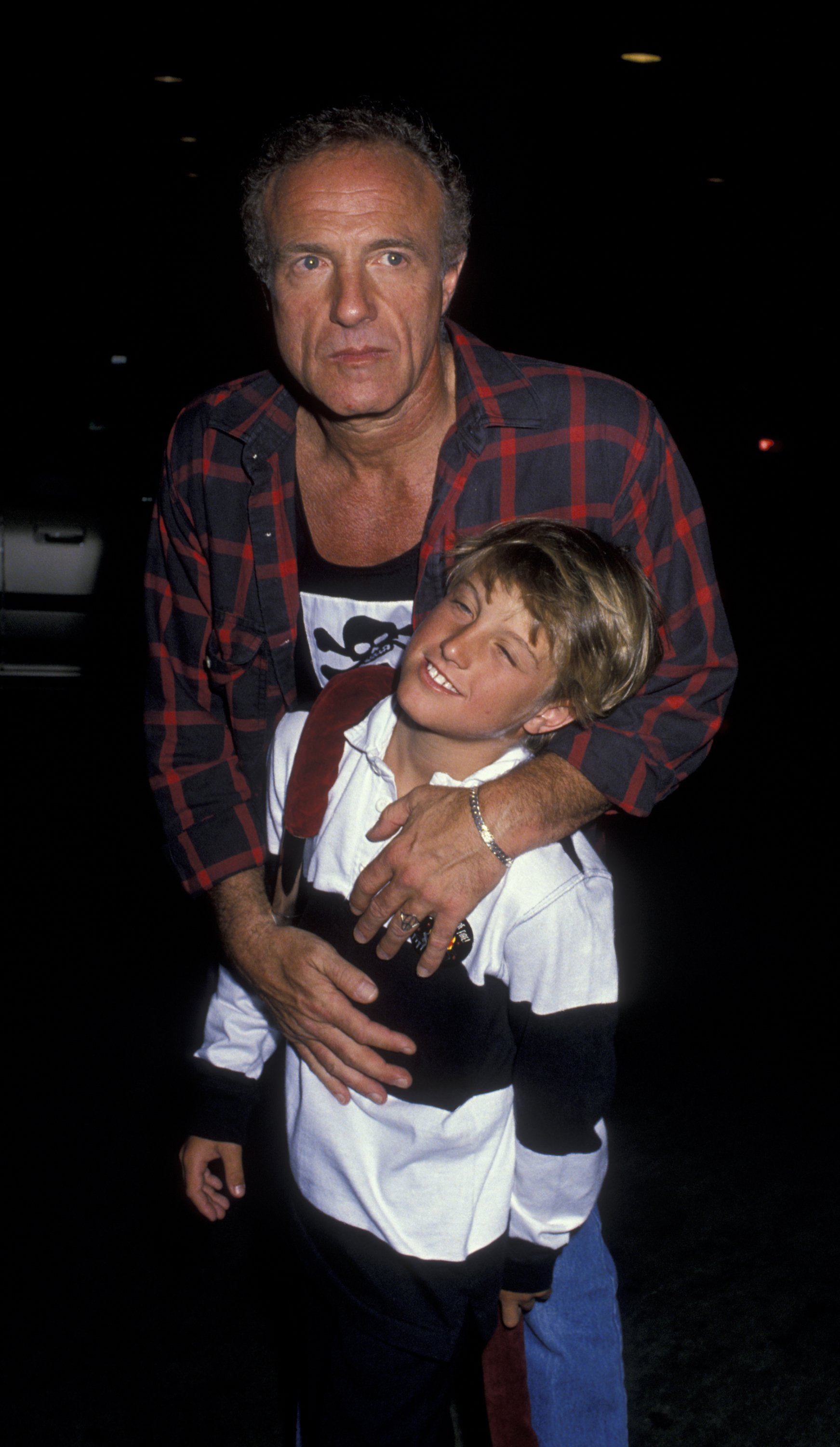 James and Scott Caan at Greg Gorman's birthday party on June 29, 1989, in Beverly Hills, California. | Source: Getty Images