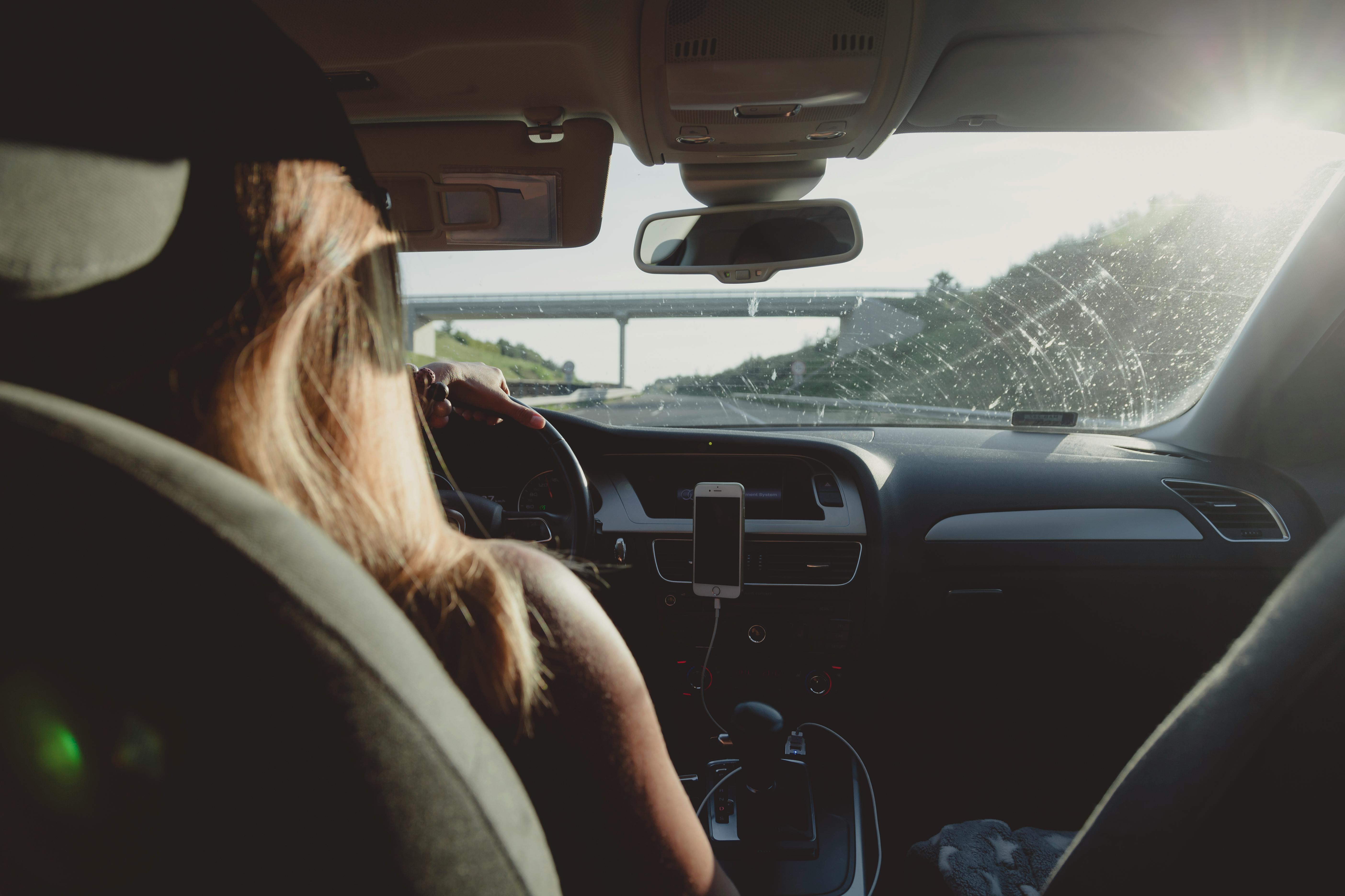 A woman inside a car | Source: Pexels