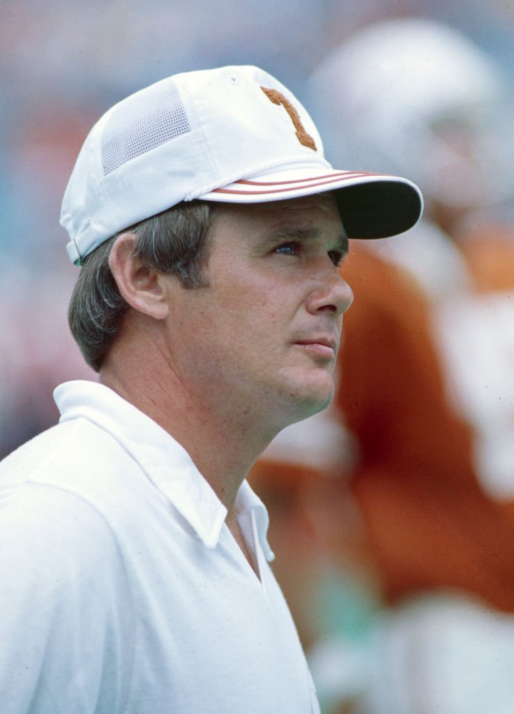 Fred Akers watches the Texas Longhorns take on the Oklahoma Sooners on October 8, 1977 at the Cotton Bowl in Dallas, Texas. | Photo: Getty Images