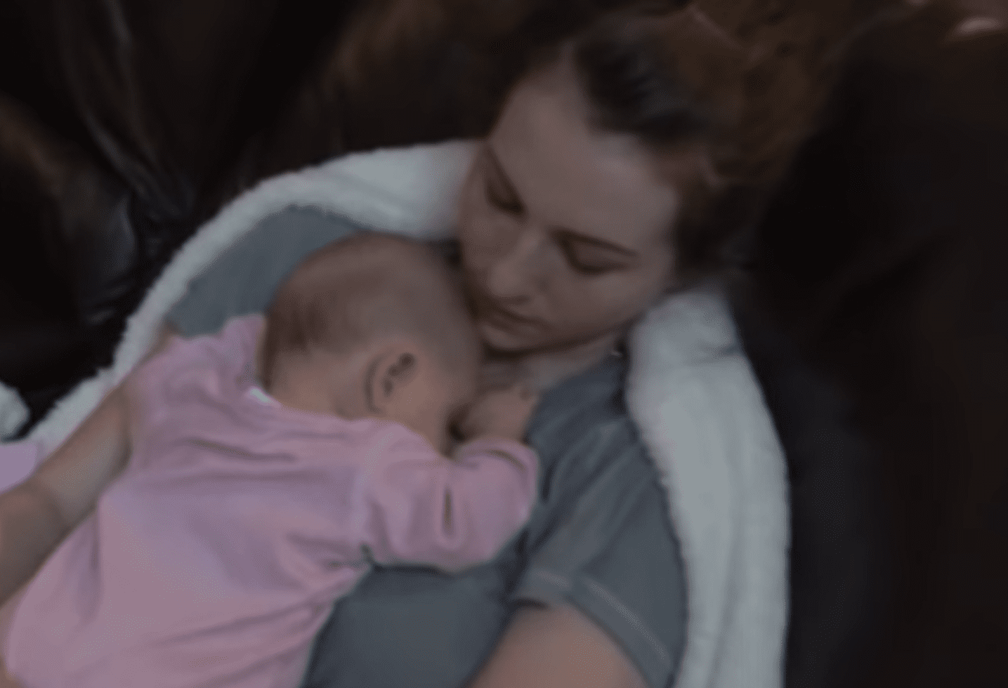 Alyssa Galios holding her 7-month-old baby girl Austin. │Source: youtube.com/Alyssa Galios