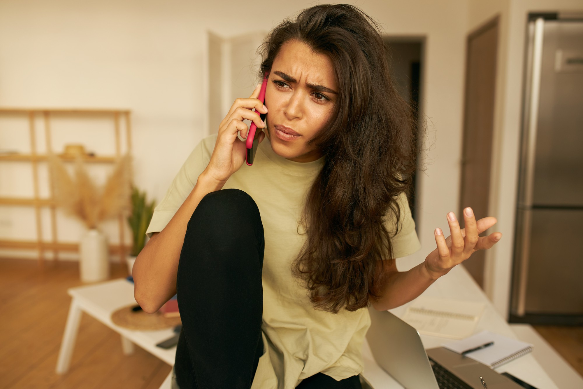 A woman frowning while explaining something gesturing with her hand | Source: Freepik