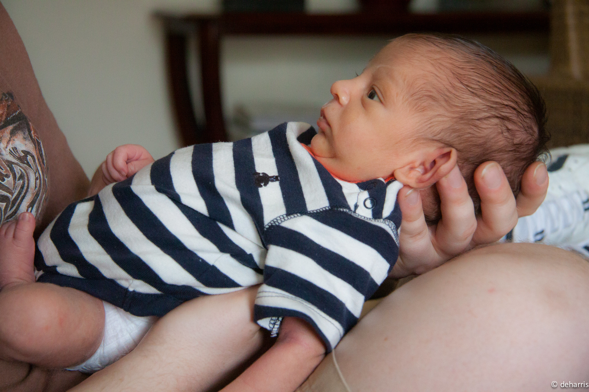 Woman holding a newborn baby | Source: Shutterstock