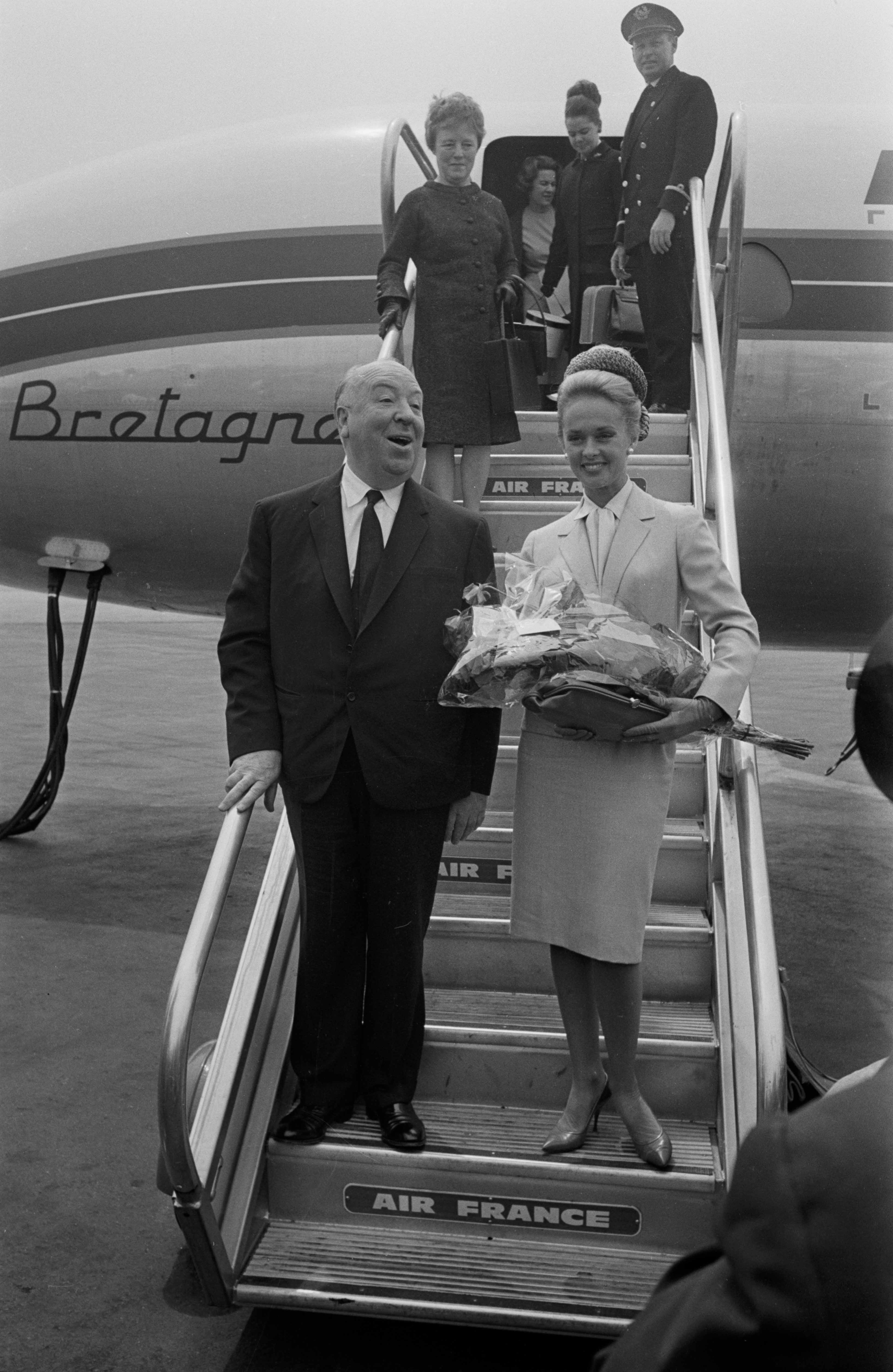 Alfred Hitchcock and Tippi Hedren at Nice airport for the Cannes Film Festival, France, on May 11, 1963. | Source: Getty Images