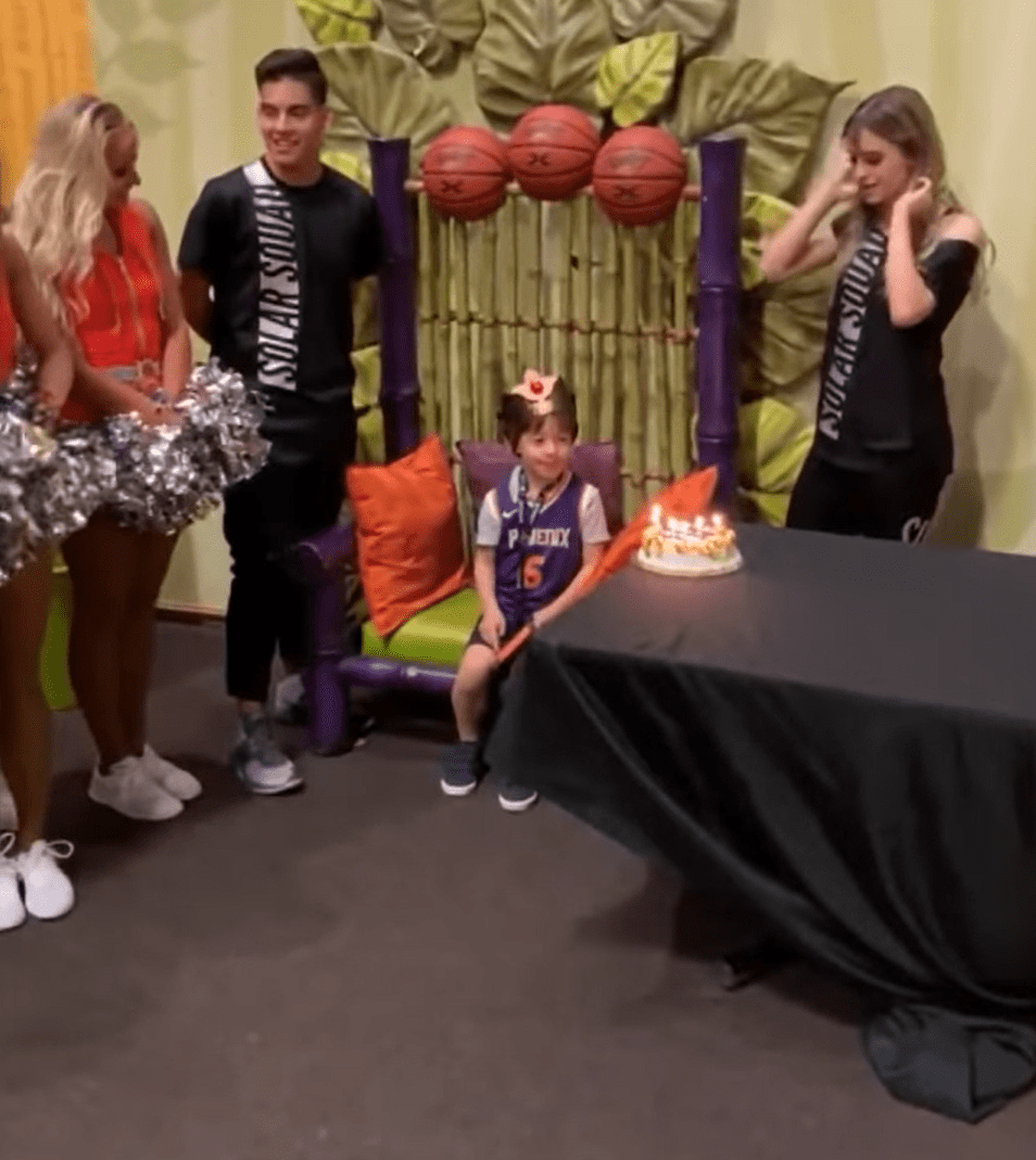 Teddy being sang a happy birthday song to and blow out the candles on his cake. | Source: youtube.com/Inside Edition
