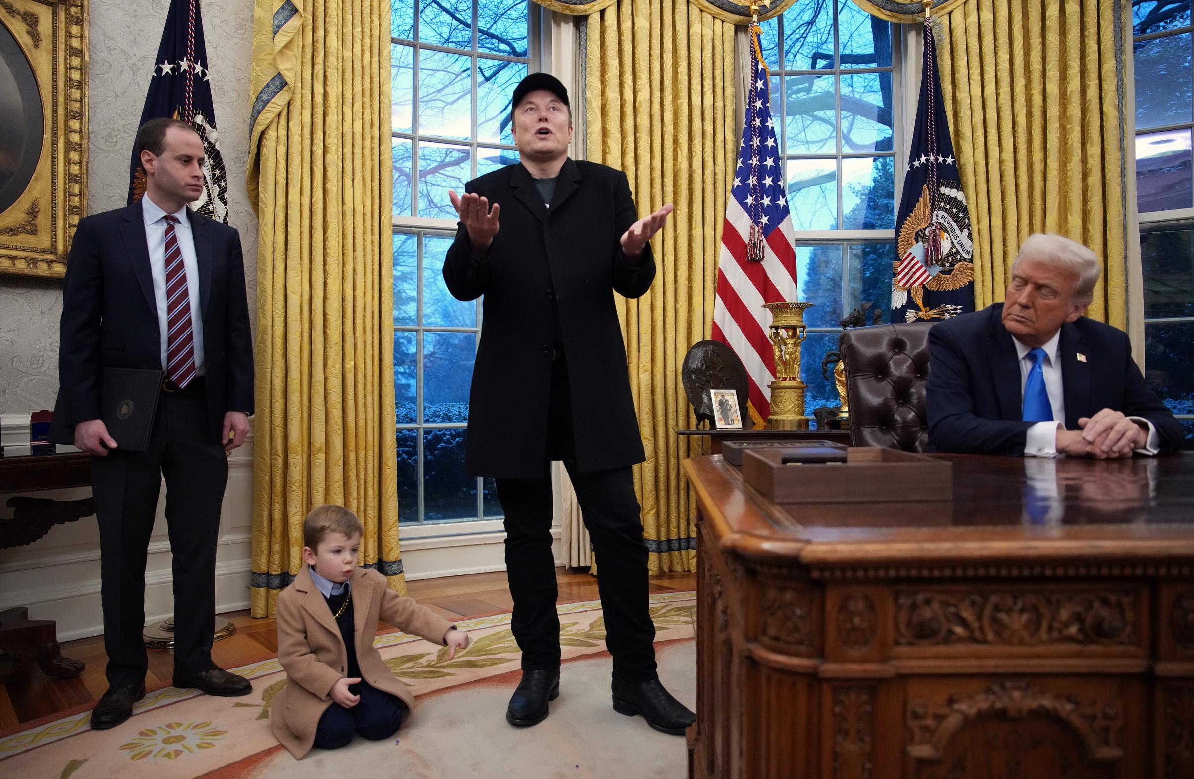 Elon Musk, joined by X Æ A-Xii, delivers remarks alongside Donald Trump. | Source: Getty Images