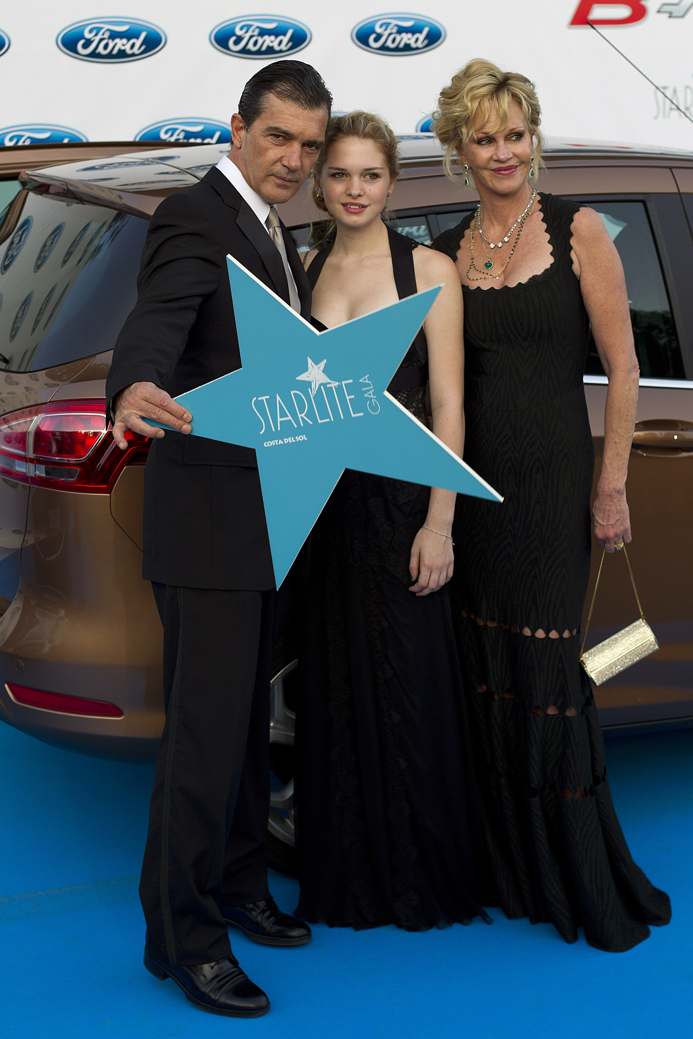 Antonio Banderas, his daughter Stella and Melanie Griffith attend the 3rd annual Starlite Charity Gala in Marbella, Spain on August 4, 2012 | Source: Getty Images