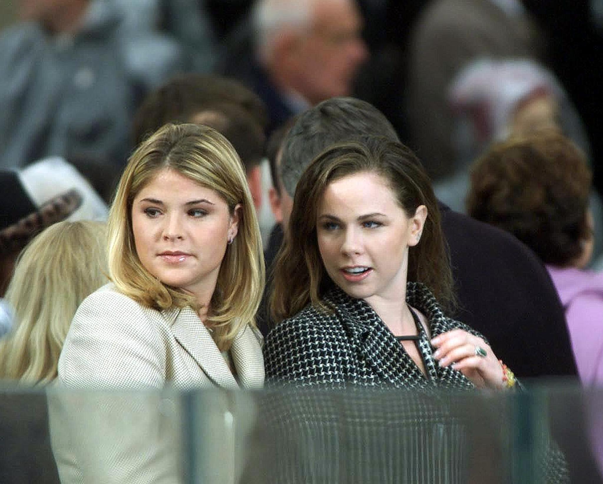 Jenna and Barbara Bush, stand on the podium as they await their father, George W. Bush's inauguration 20 January 2001 at the US Capitol in Washington, DC  | Source: Getty Images