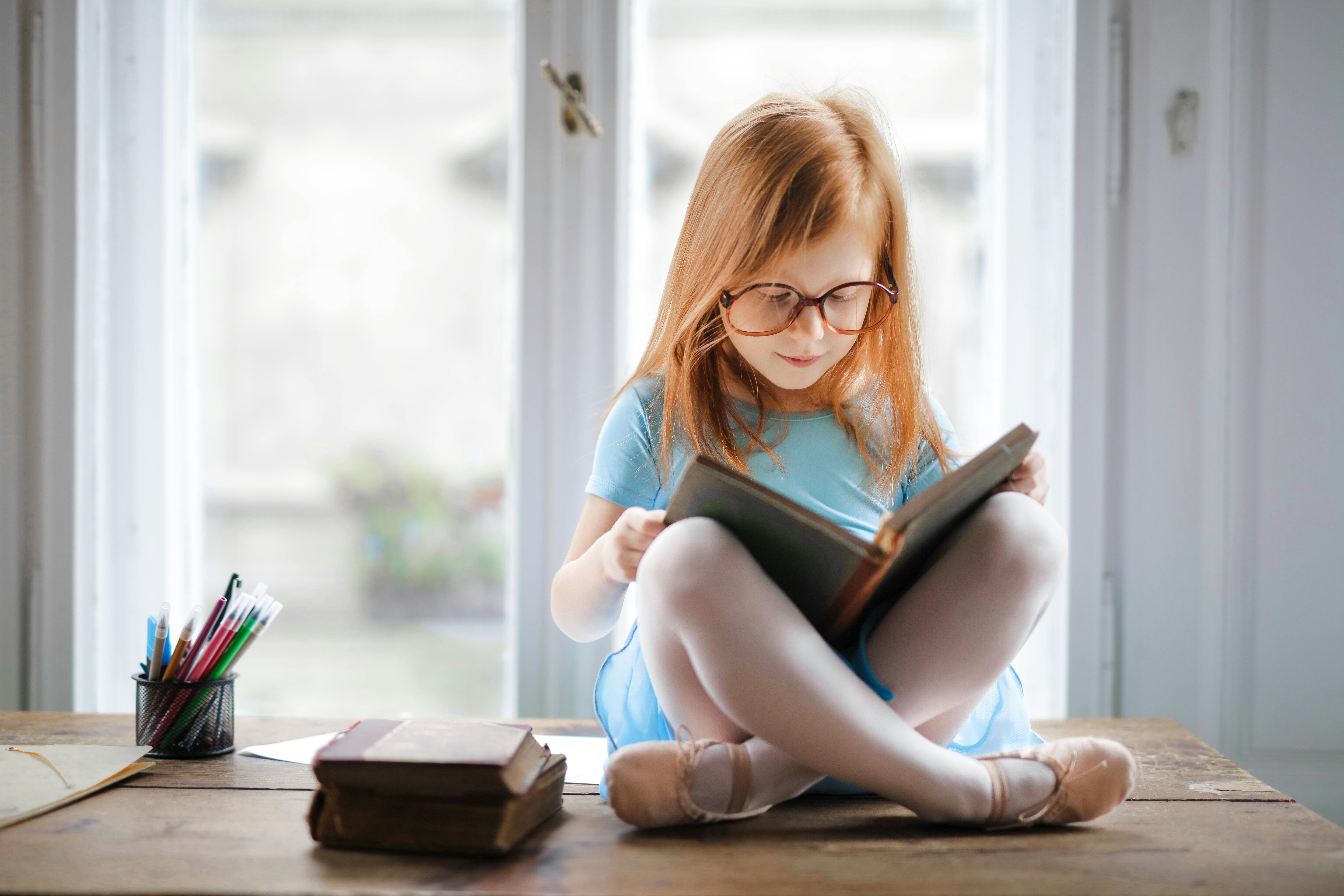 A child reading a book | Source: Pexels