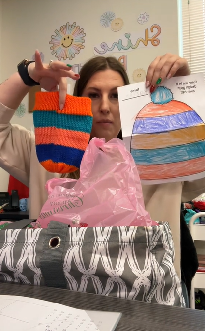 Mrs. White showing some of the hats her mother created for her second-grade class for Christmas on TikTok on December 5, 2023 | Source: TikTok/Mrs. White