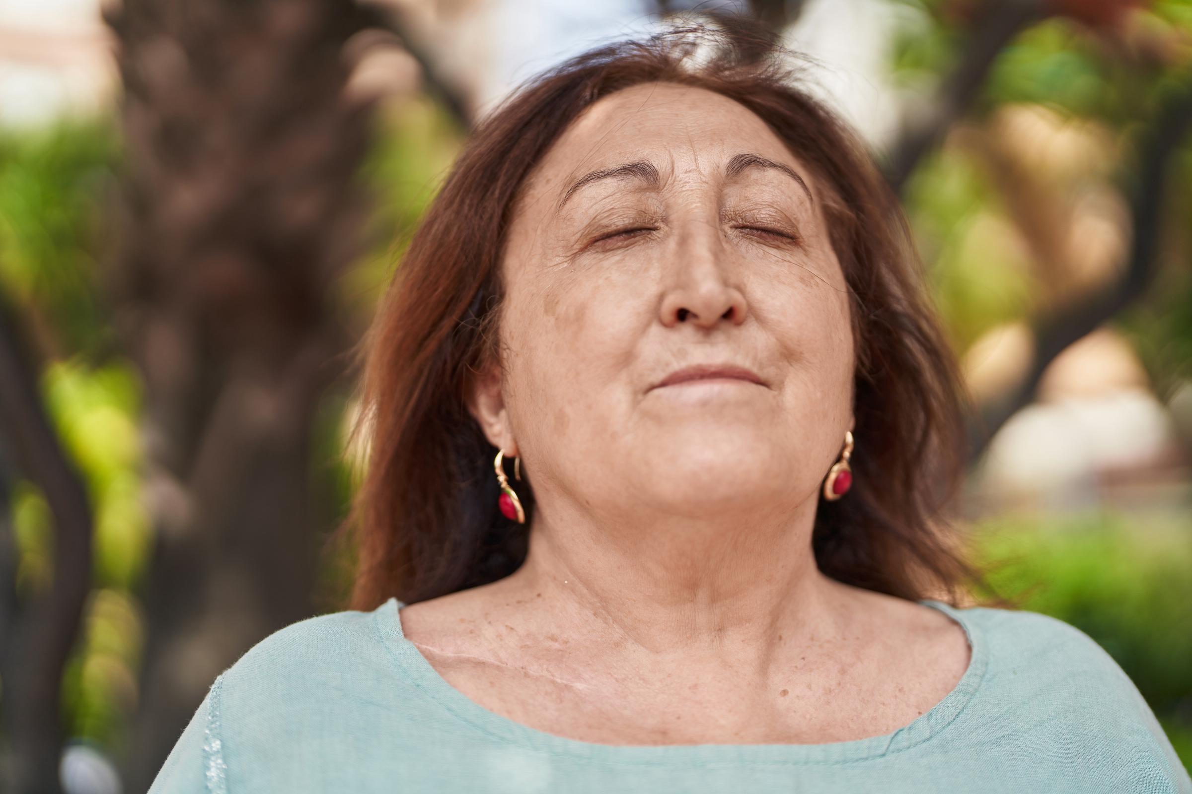 Woman inhaling | Source: Shutterstock